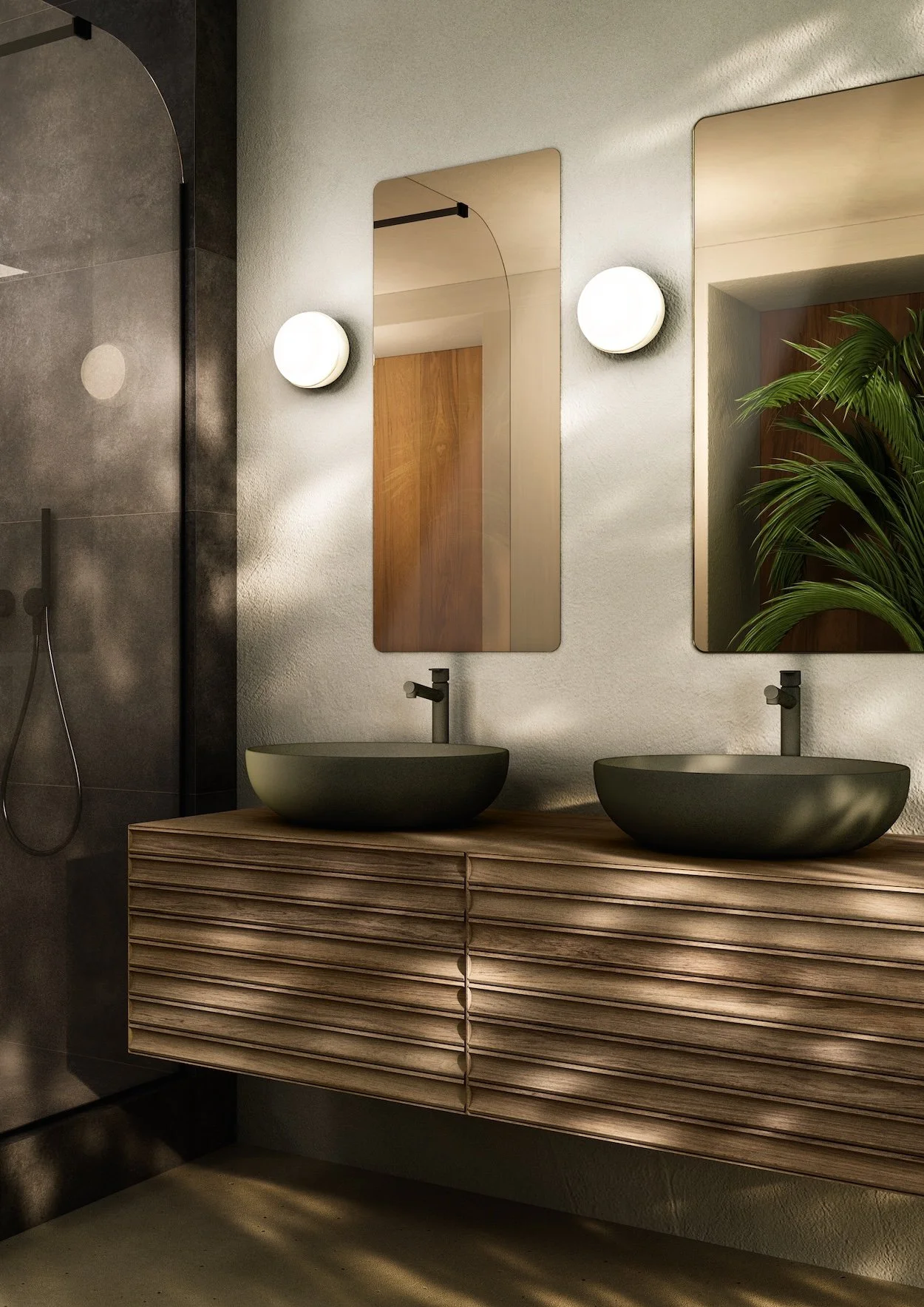 Modern bathroom with two oval vessel sinks on a wooden vanity, oval mirrors, and wall-mounted lights.