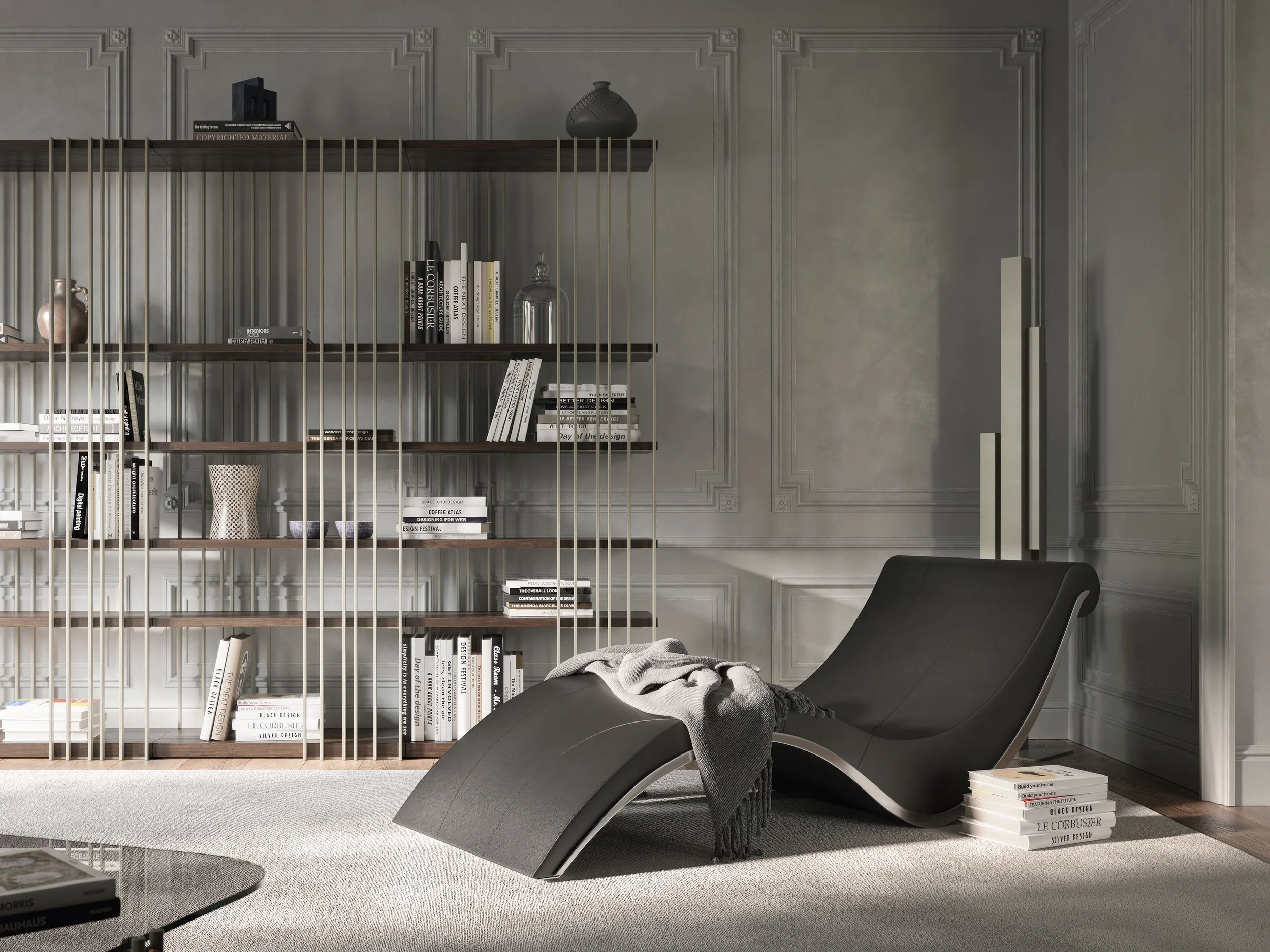 Modern living room with gray paneled walls, a bookshelf behind metal bars, and a black chaise lounge with a throw blanket. Books are stacked on the floor and a gray rug covers the floor.