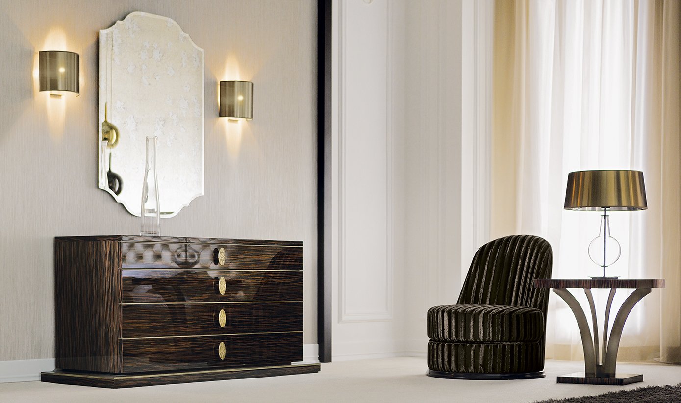Interior of a room with a dark wooden dresser, a mirror, two wall sconces, a black striped chair, a side table, and a table lamp near a window with curtains.