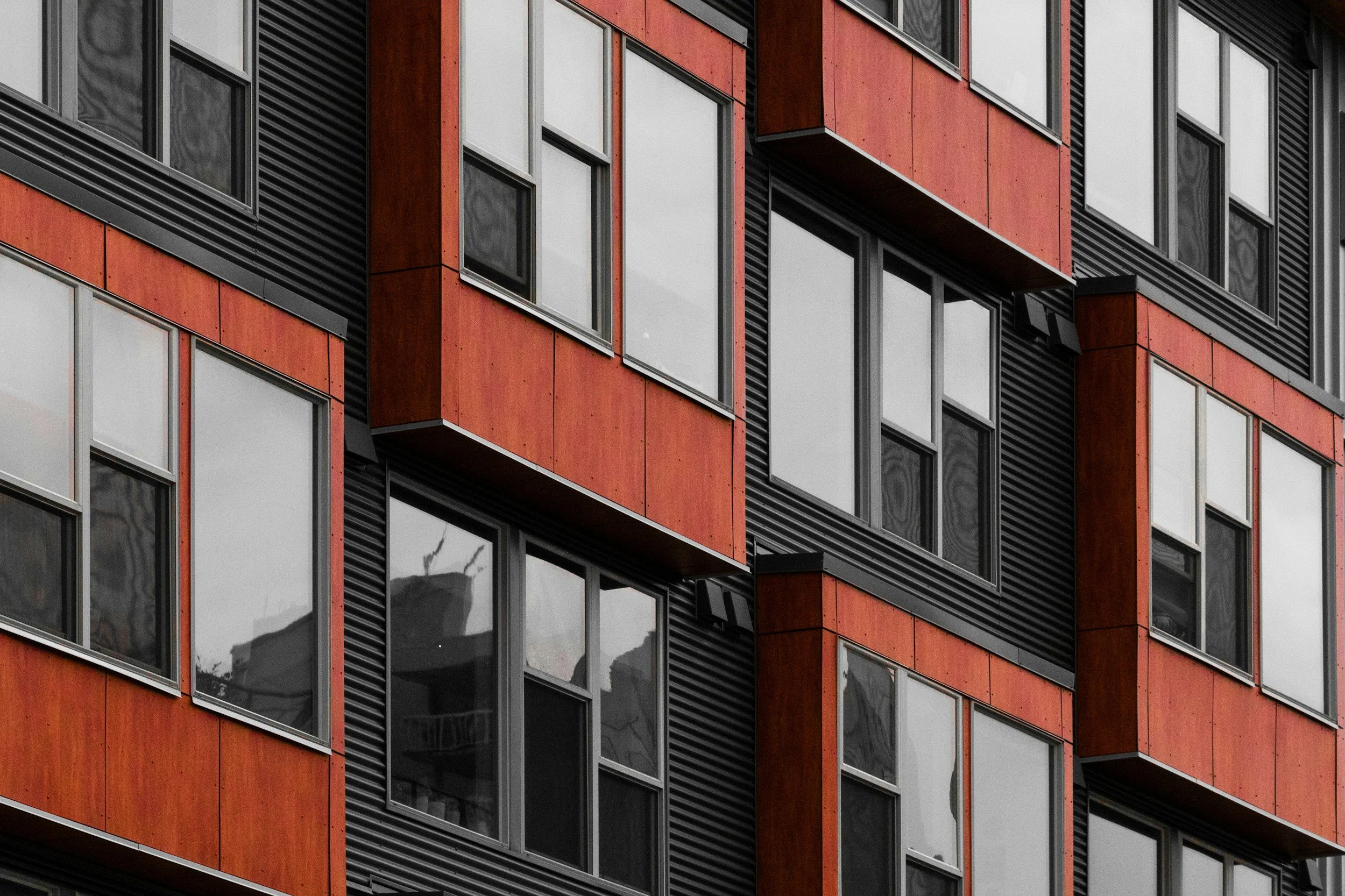 apartment block in terracotta and black housing concept