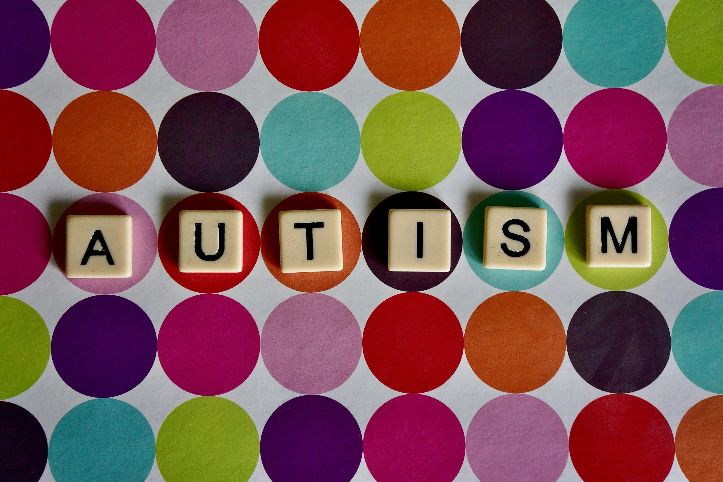 the word autism spelt out in letter blocks