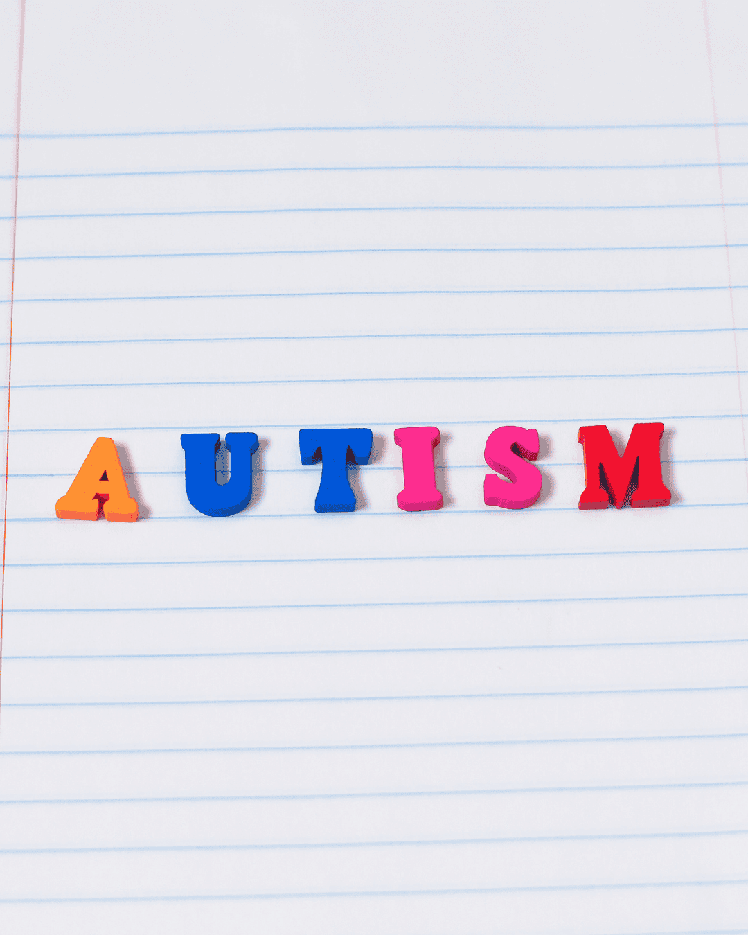 letter blocks spell out autism