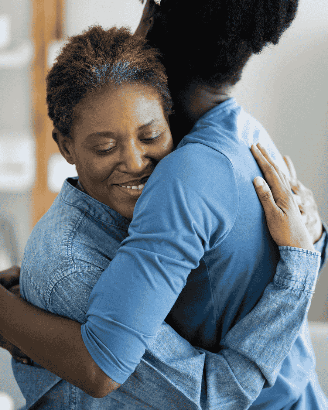 a woman hugs a carer