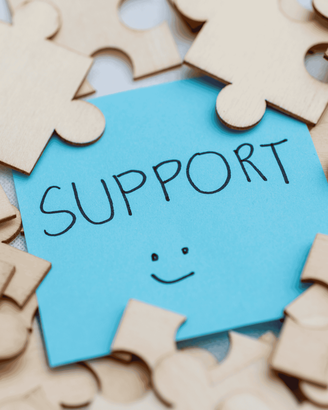 post it note with the words support written on it