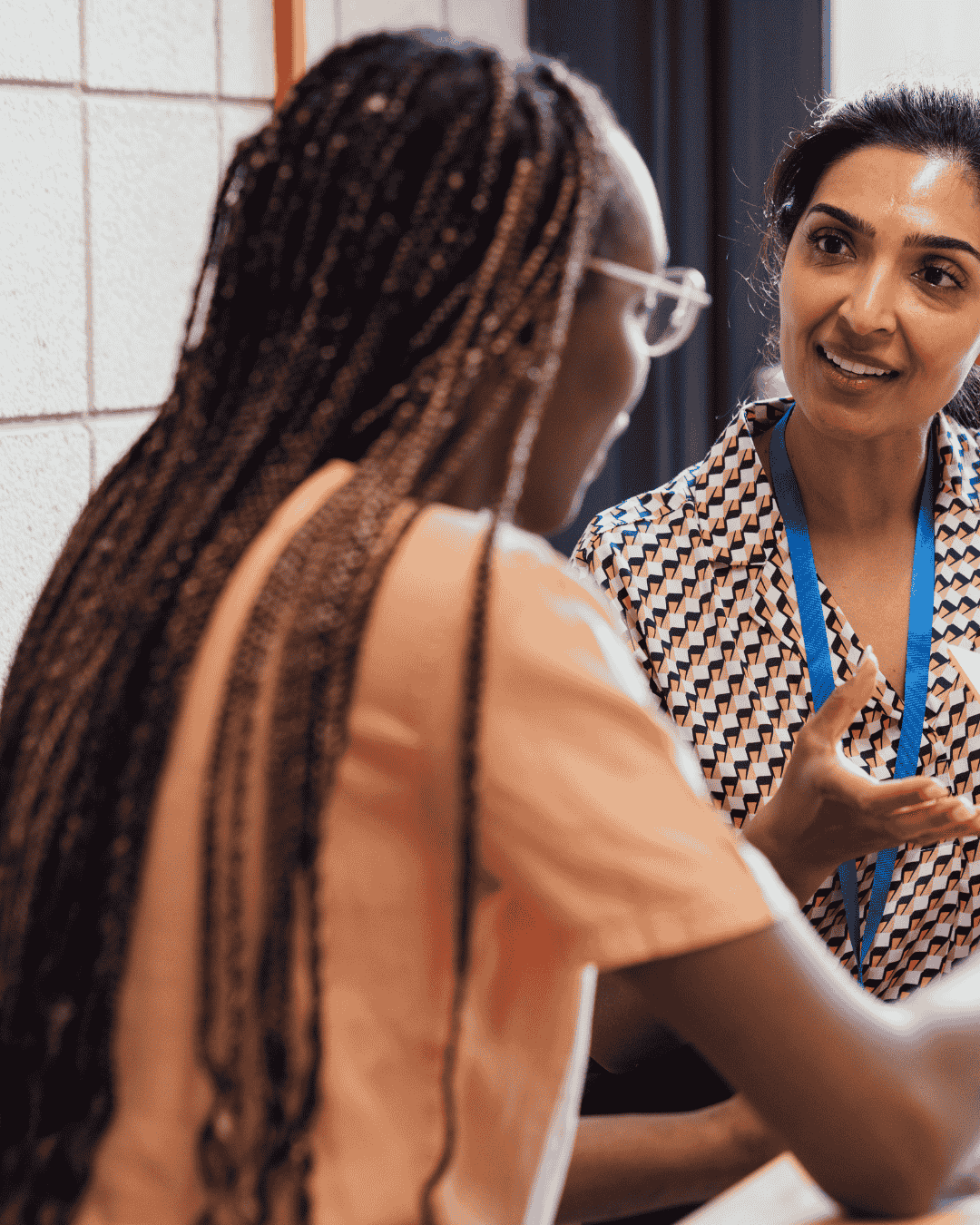 two professionals discuss the care of service users