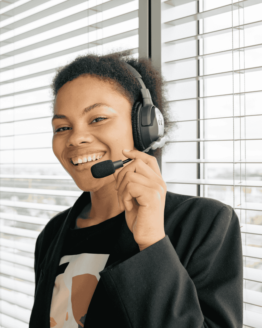 a friendly woman speaks on a phone receiving support work referral concept