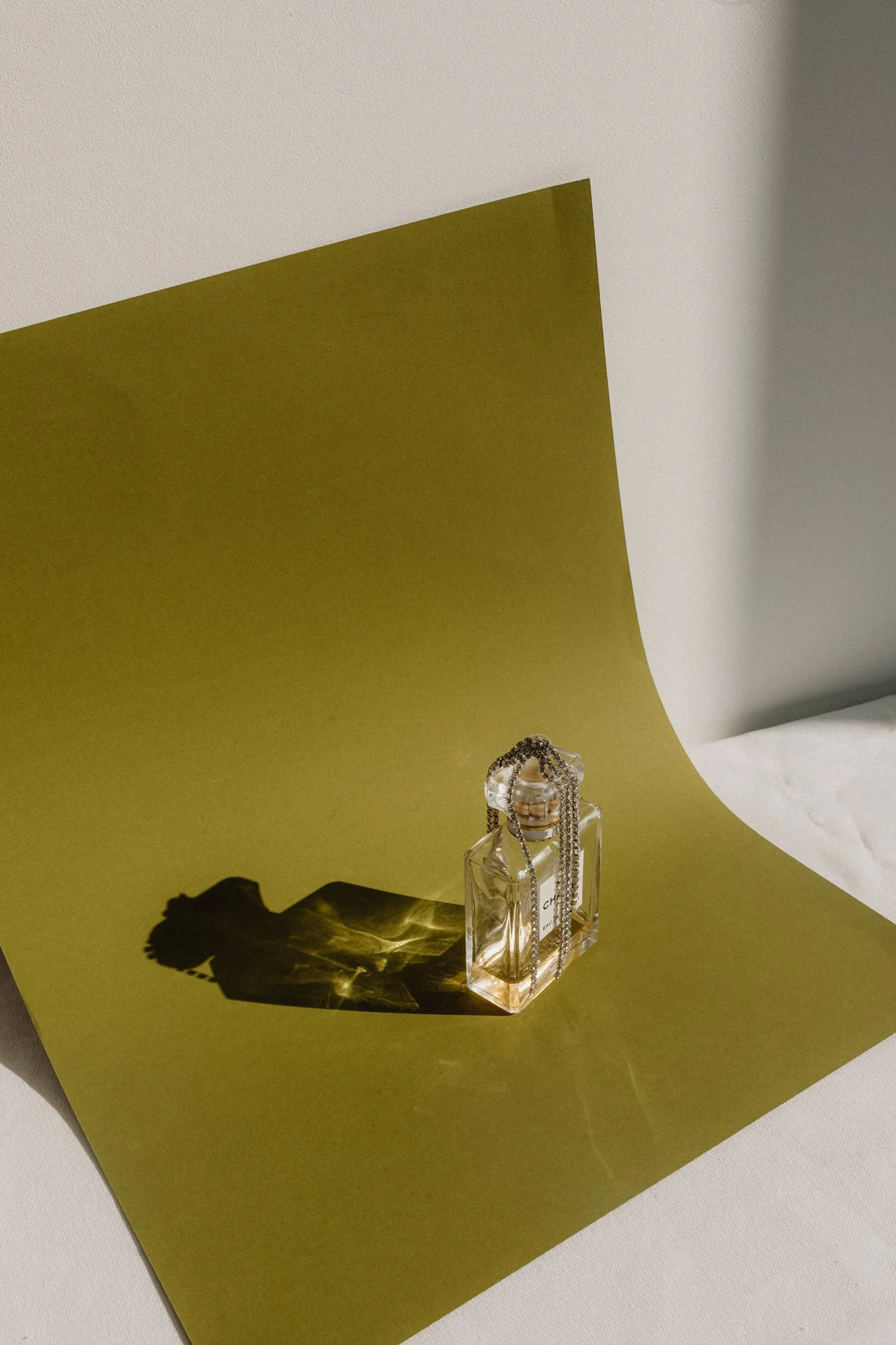 kaboompics_refined-aromas-perfume-bottles-cast-in-shadows-and-light-35445.jpg