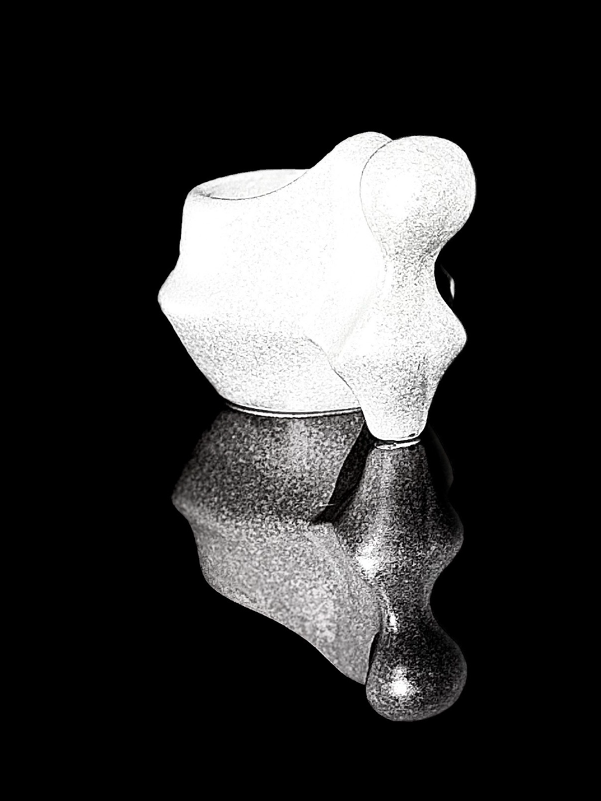 Black-and-white still life of a sculptural Romanian coffee cup used as the signature image for CRN Studio.