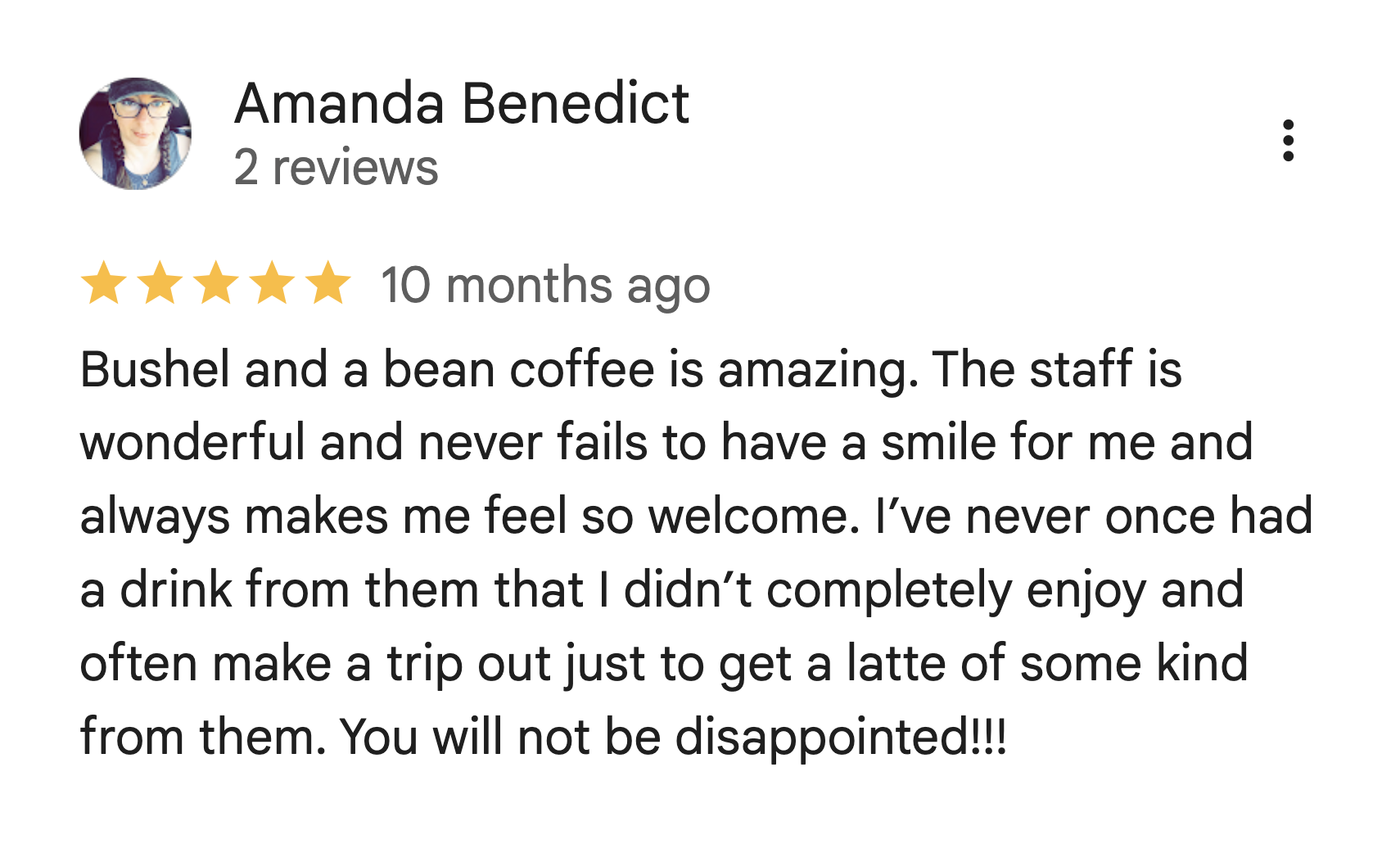 Screenshot of a review by Amanda Benedict for a coffee shop, with a profile picture of a woman with glasses, long braided hair, and a blue top. The review gives five stars and mentions the quality of the coffee, friendly staff, and her positive experiences.