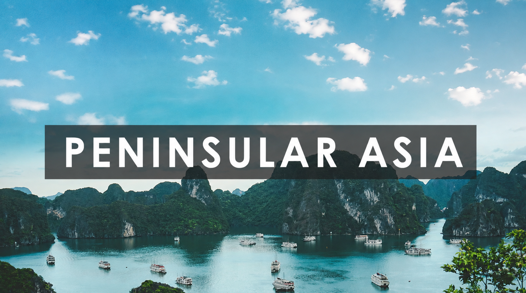 Scenic view of Halong Bay in Vietnam with limestone islands and boats on calm water under a partly cloudy sky, labeled 'Peninsular Asia'.