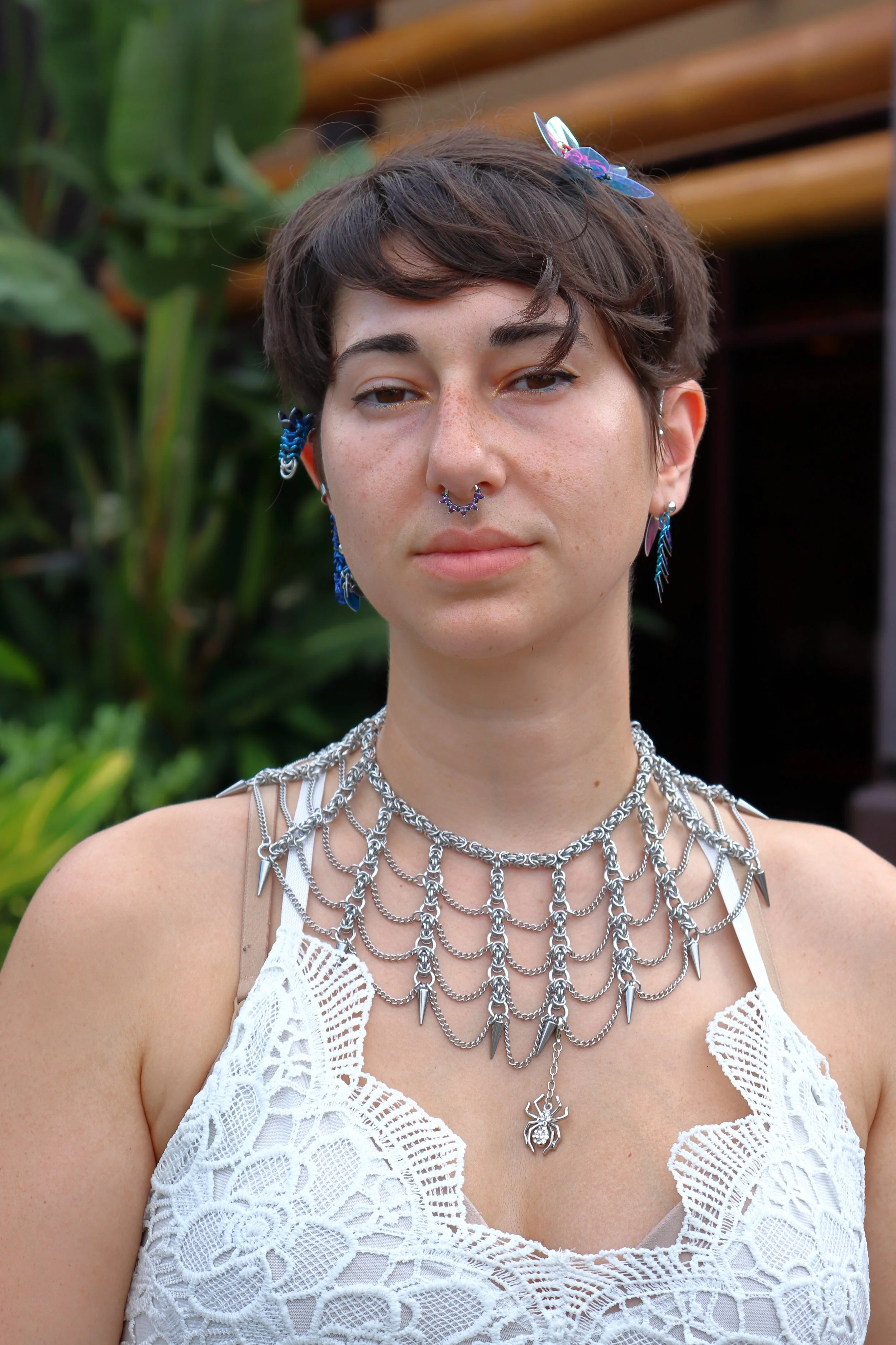 The Spiderweb Choker is one of our more unique pieces. Also worn by our model here is one of the Dragon ear cuffs and the Dragon Tail earring.
