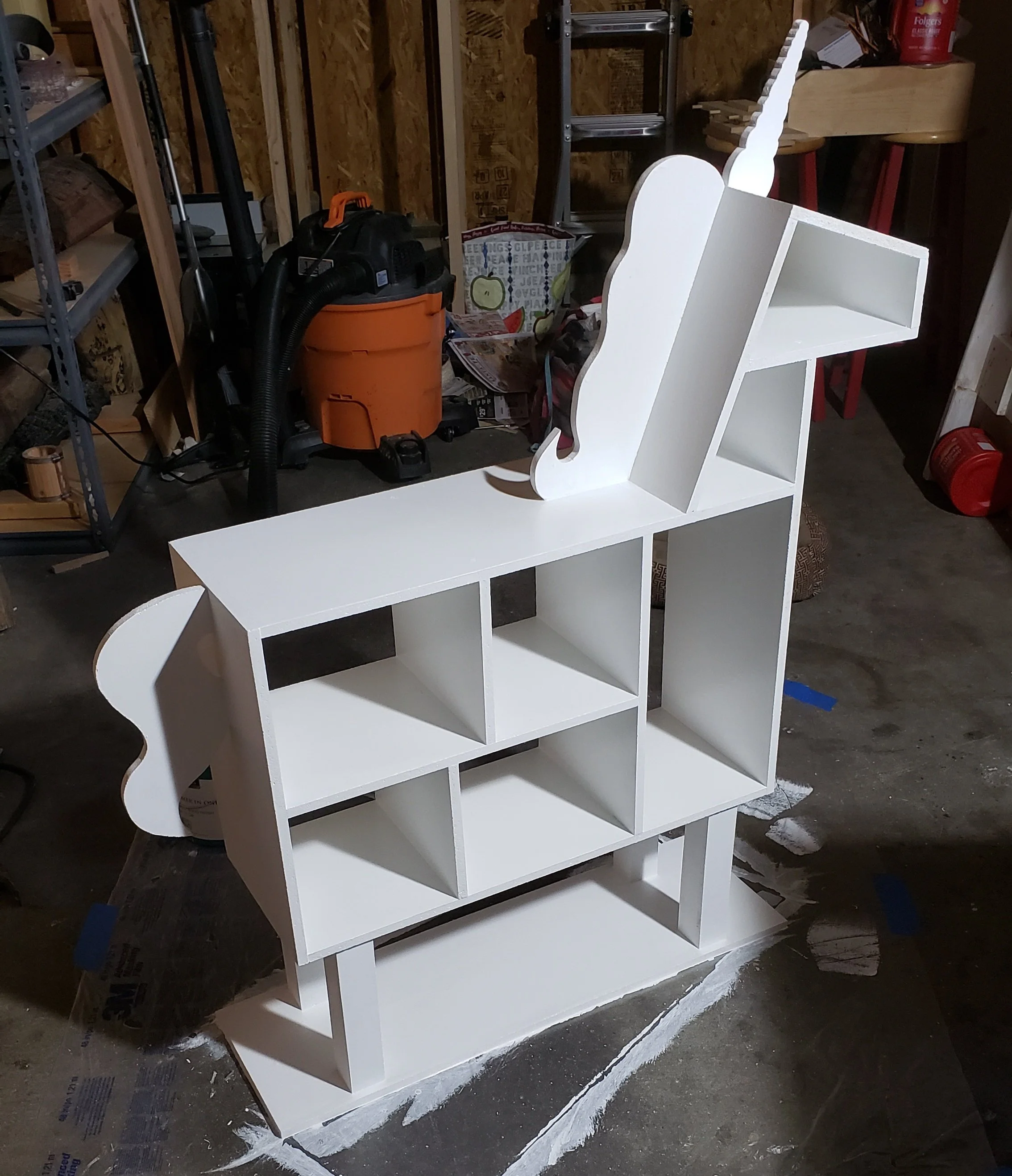 A in the process of completion photo of a special unicorn bookshelf for a special little girl.