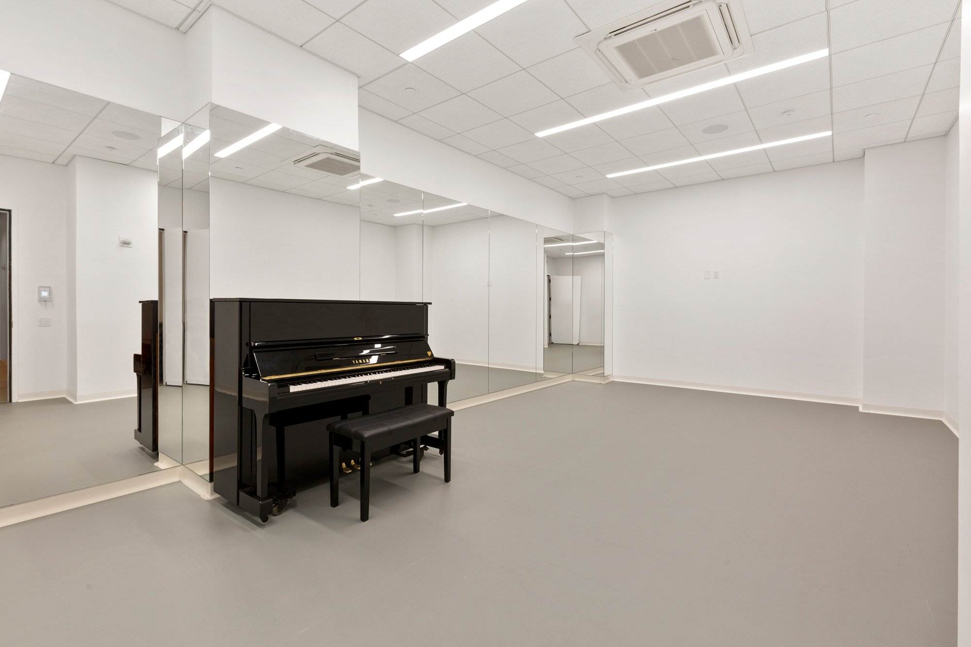 medium rehearsal studio with piano