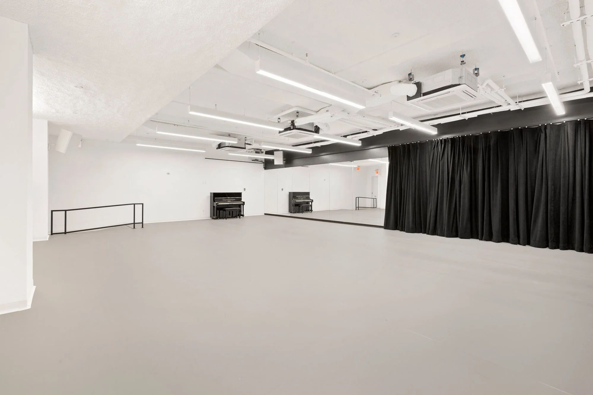 Extra large rehearsal room with marley floors, mirrors and piano