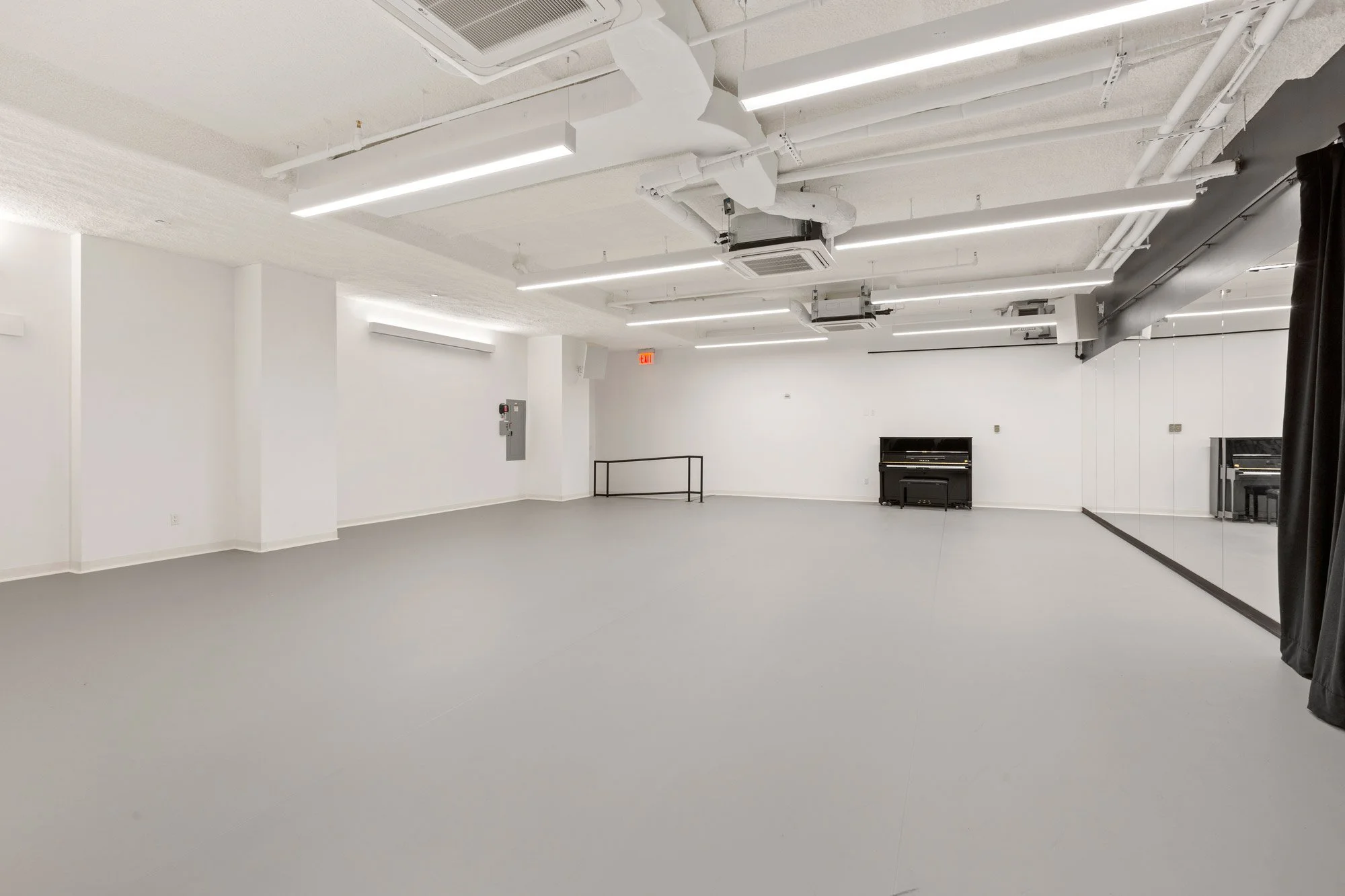 Extra large rehearsal room with marley floors and piano
