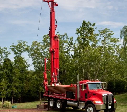 Upfront Well Company air-rotary drilling rig on a new construction site in Raleigh, NC.