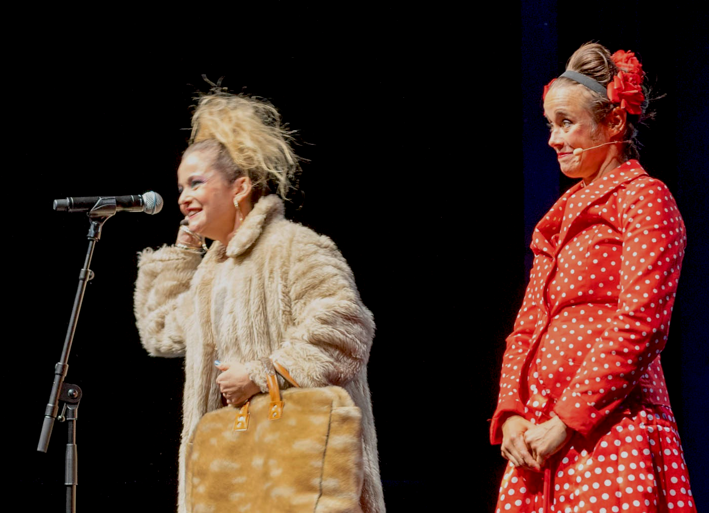 Amelia & Jessica Presenting Mic.png