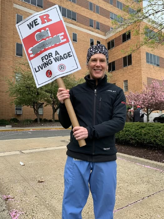 Woman holding a sign at a rally