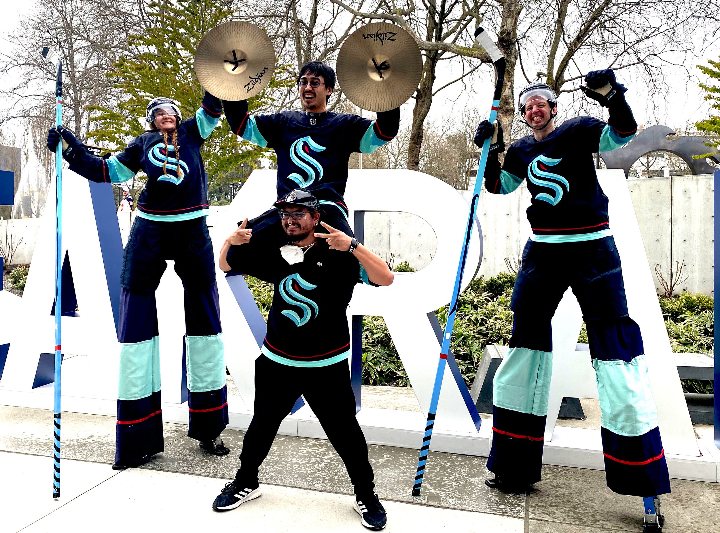 Kraken Stilt team with Red Alert Marching Band. 