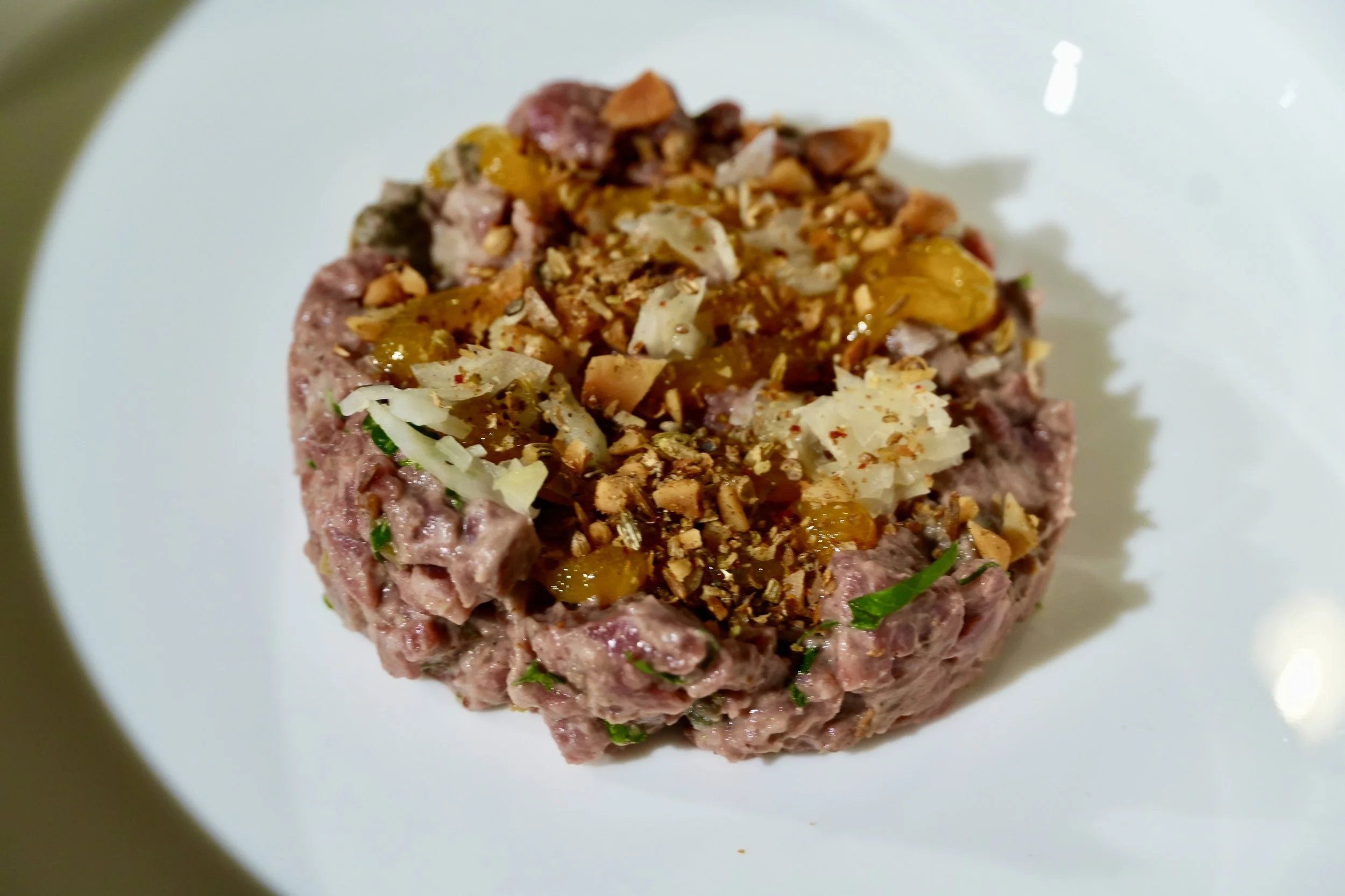 beef tartare, charred eggplant emulsion, pickled fennel, macadamia nut dukkah, egg jam