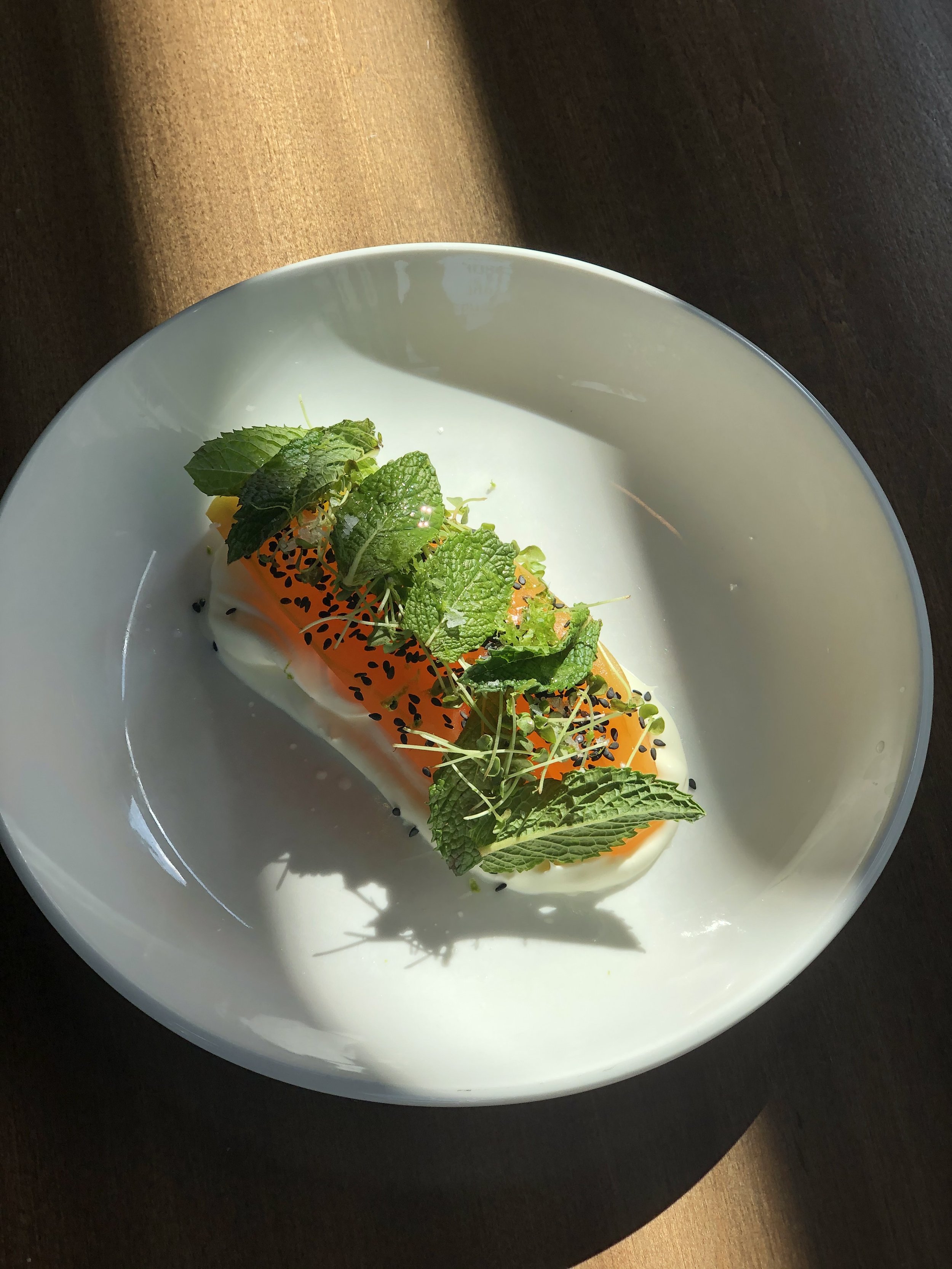 Summer:  Honey-compressed cantaloupe, creme fraiche, black sesame, herbs  