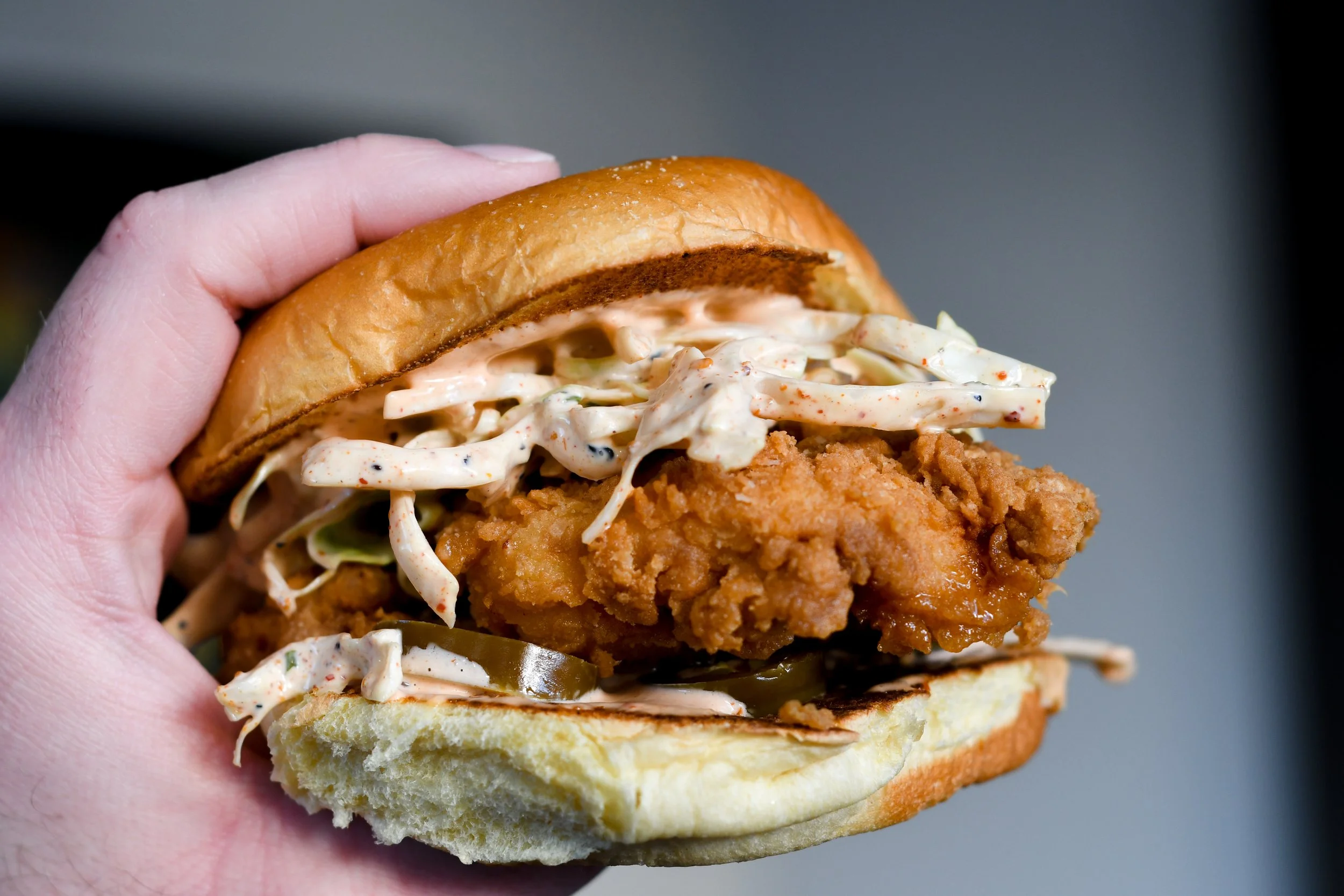 Fried chicken sandwich, Fun Ranch, slaw, and pickles 