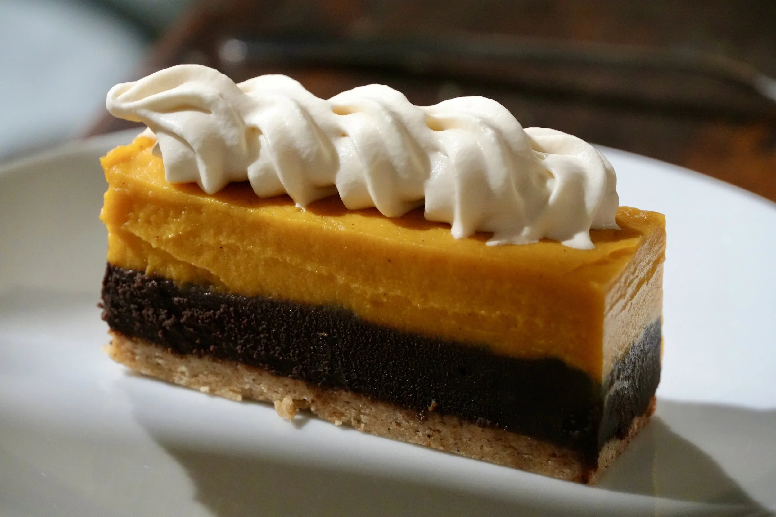 sweet potato pie, dark chocolate ganache, brown butter crumb, earl grey whipped cream 