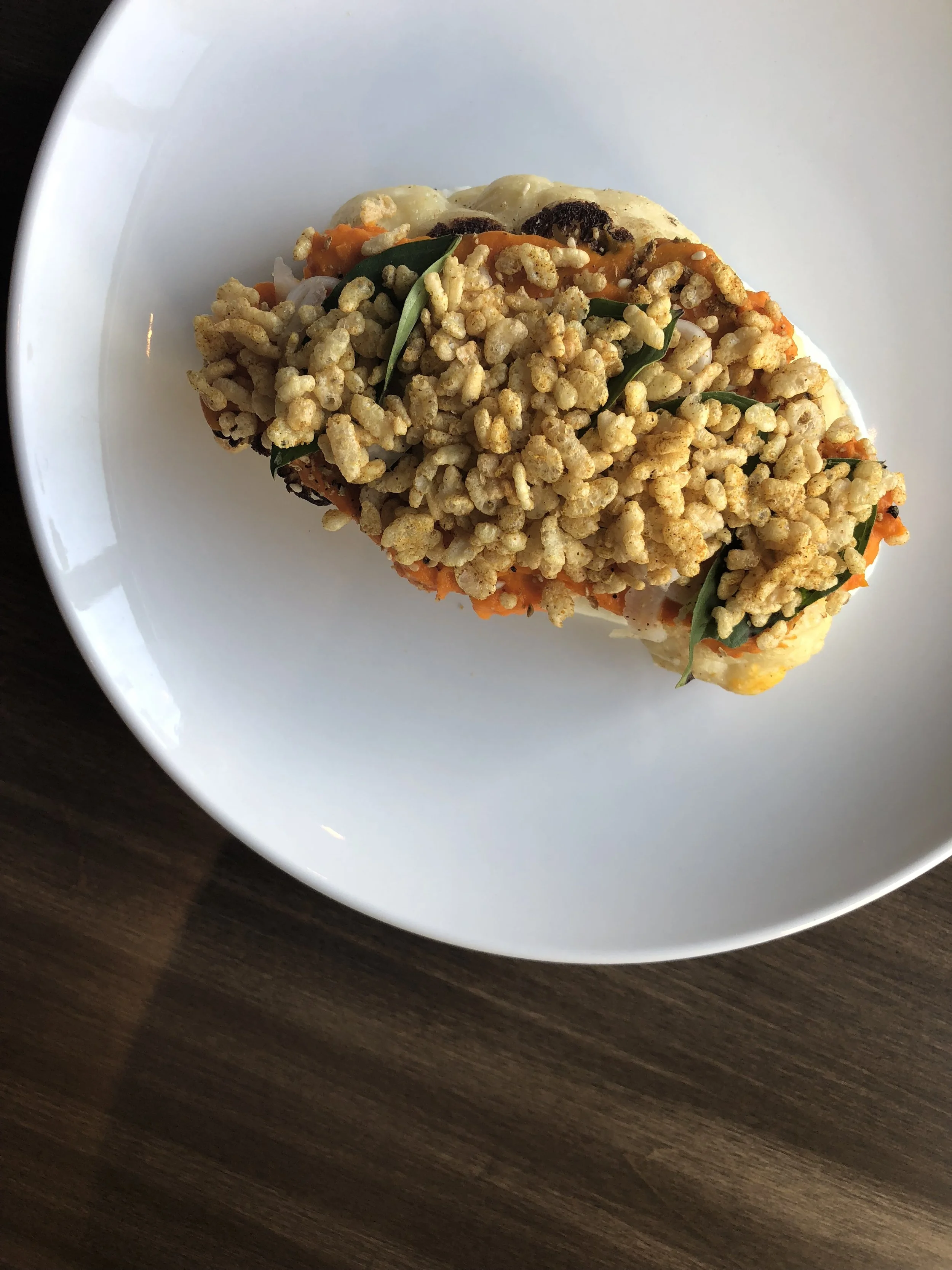 Fall: Vadouvan spiced cauliflower steak, carrot puree, pickled fennel, Thai basil, rice crispies seasoned with vadouvan 
