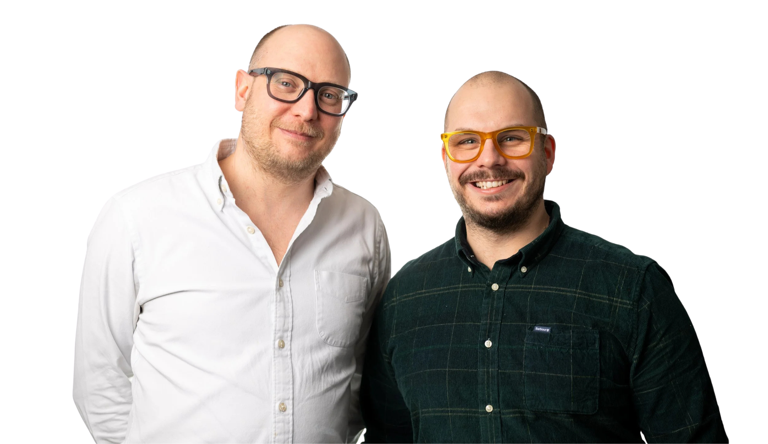 Two smiling men standing side by side, one in a white shirt with black glasses and the other in a dark shirt with orange glasses, against a partly gradient background.