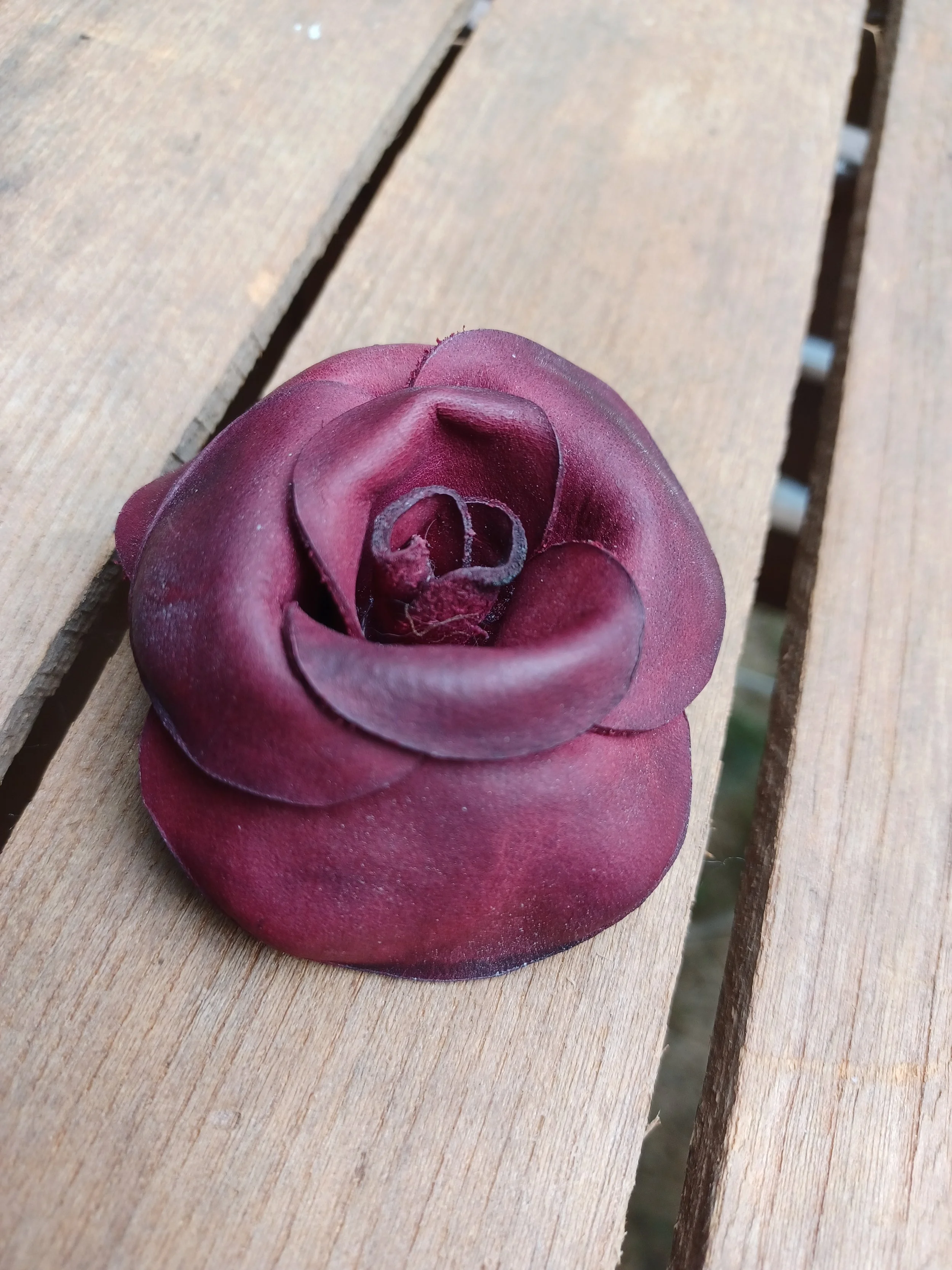 A burgundy leather rose