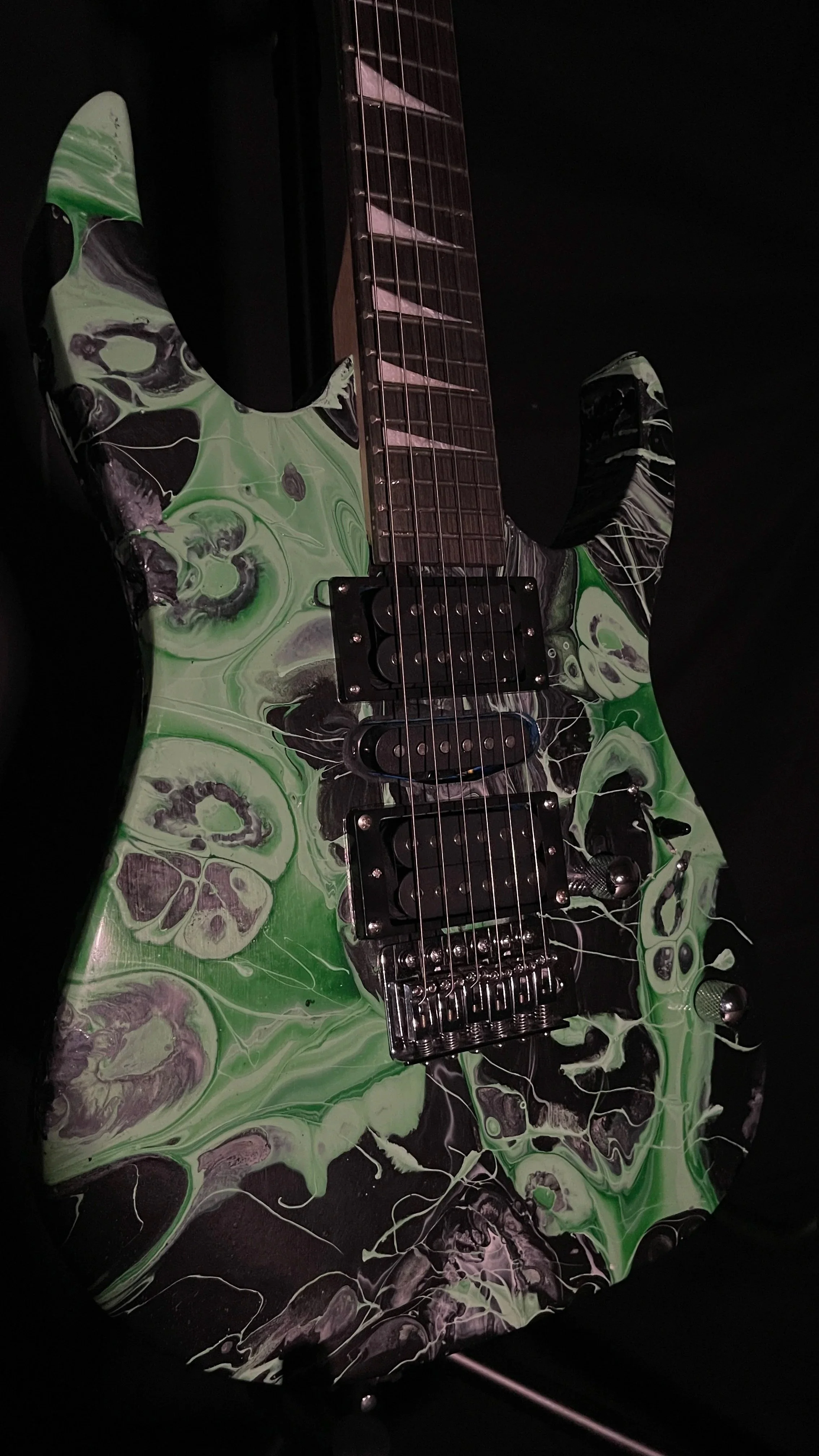 black and green acrylic poured electric guitar, called Luther
