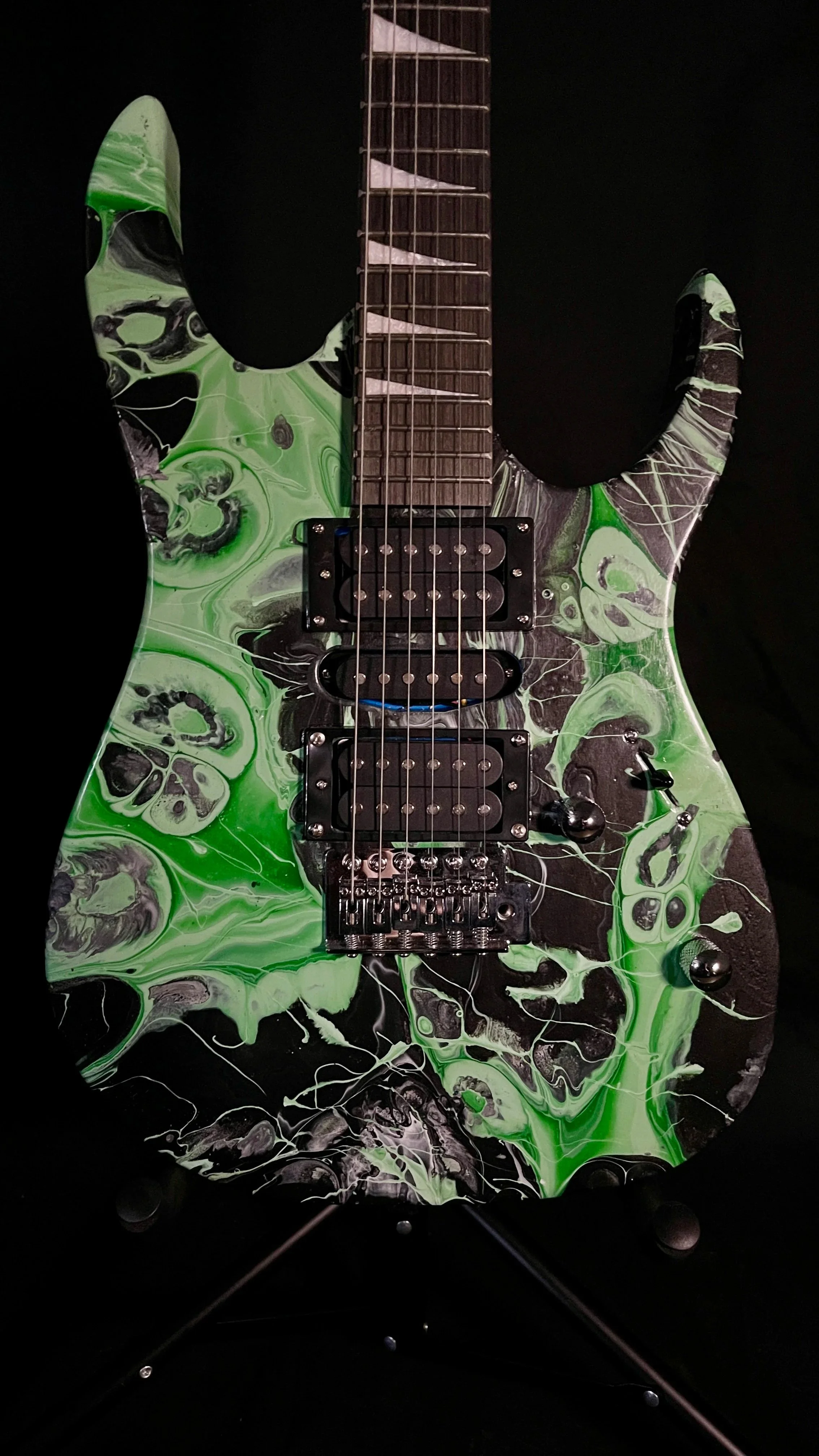 Black and green acrylic poured electric guitar