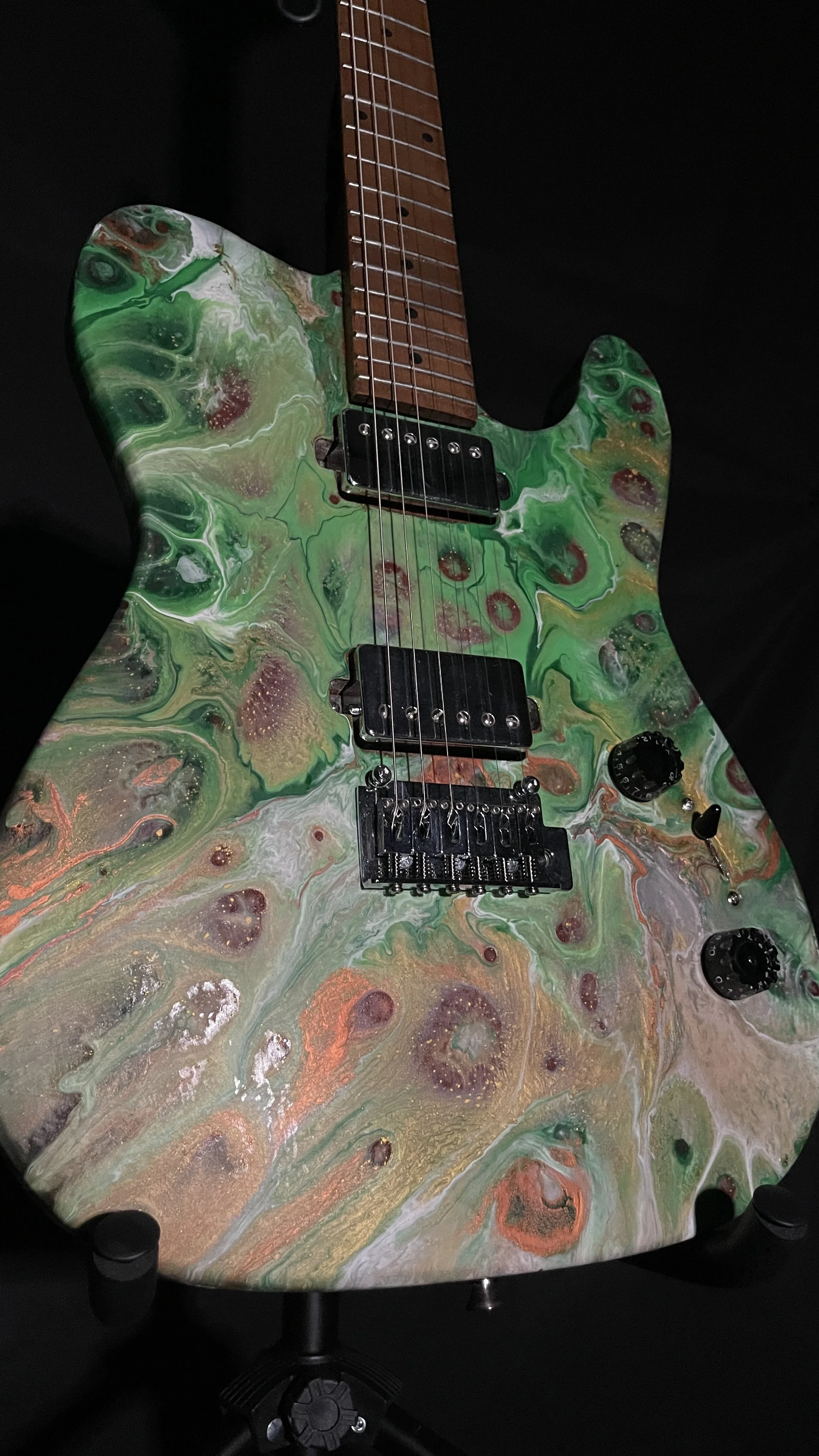 Green, white and gold acrylic poured electric guitar named Loki by Grainrot Guitars