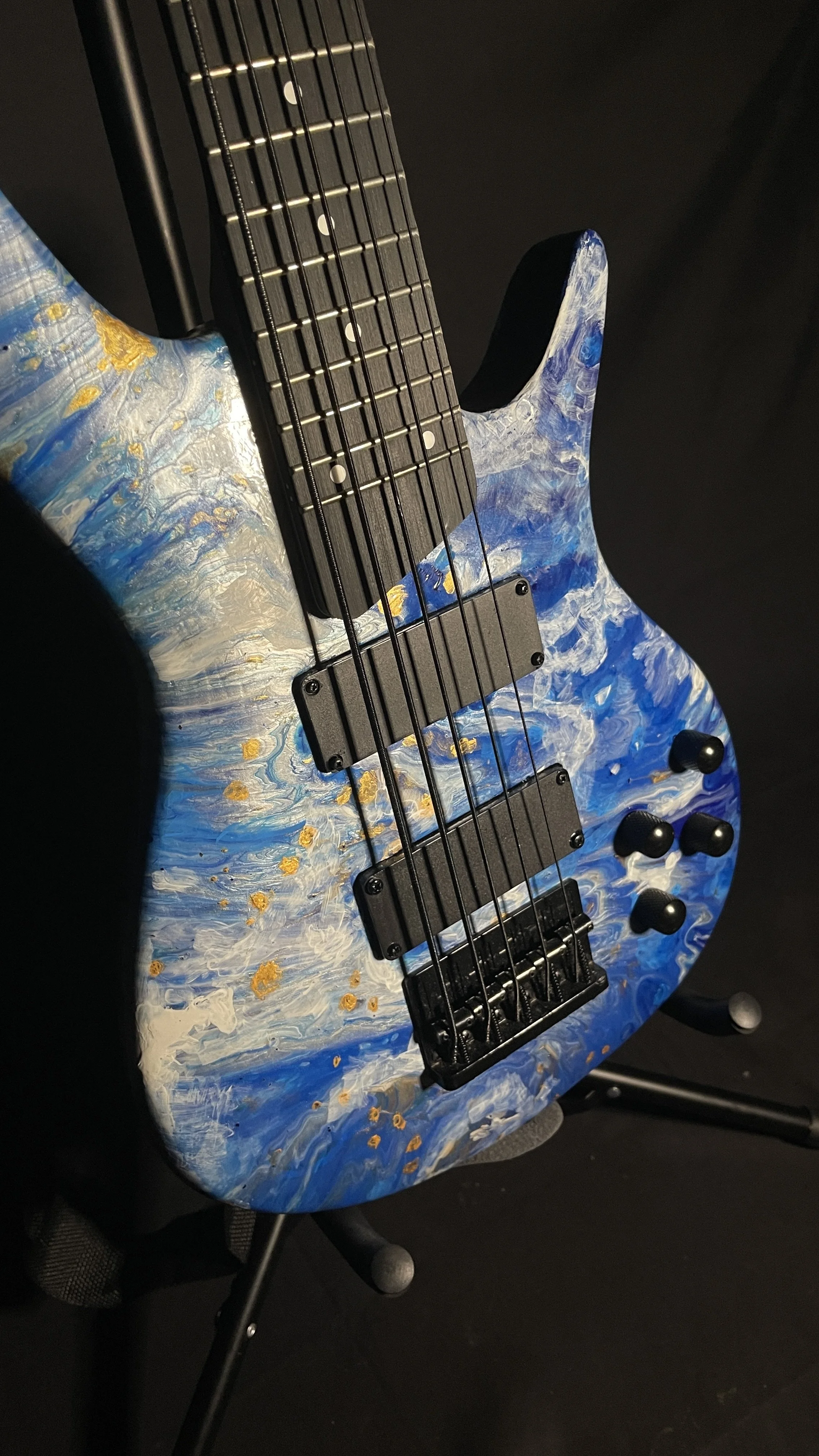 Blue, white and gold acrylic pour on a 5-string electric bass named Thalassa