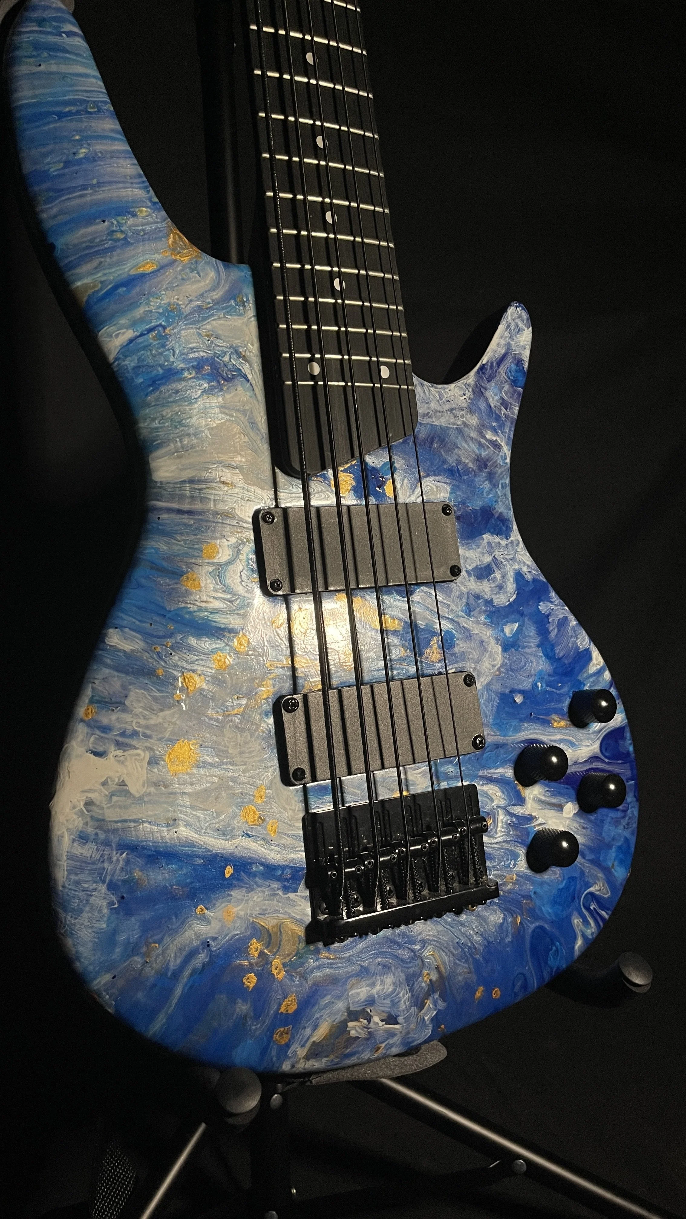 Blue, white and gold acrylic pour on a 5-string electric bass named Thalassa