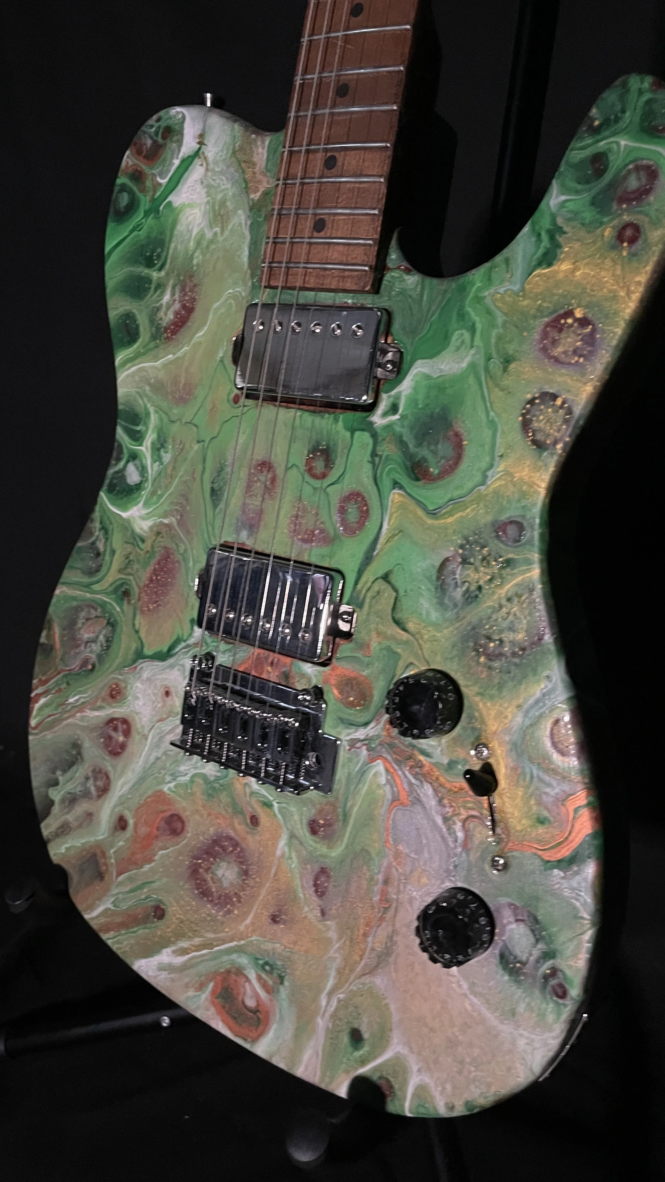 Green, white and gold acrylic poured electric guitar named Loki by Grainrot Guitars
