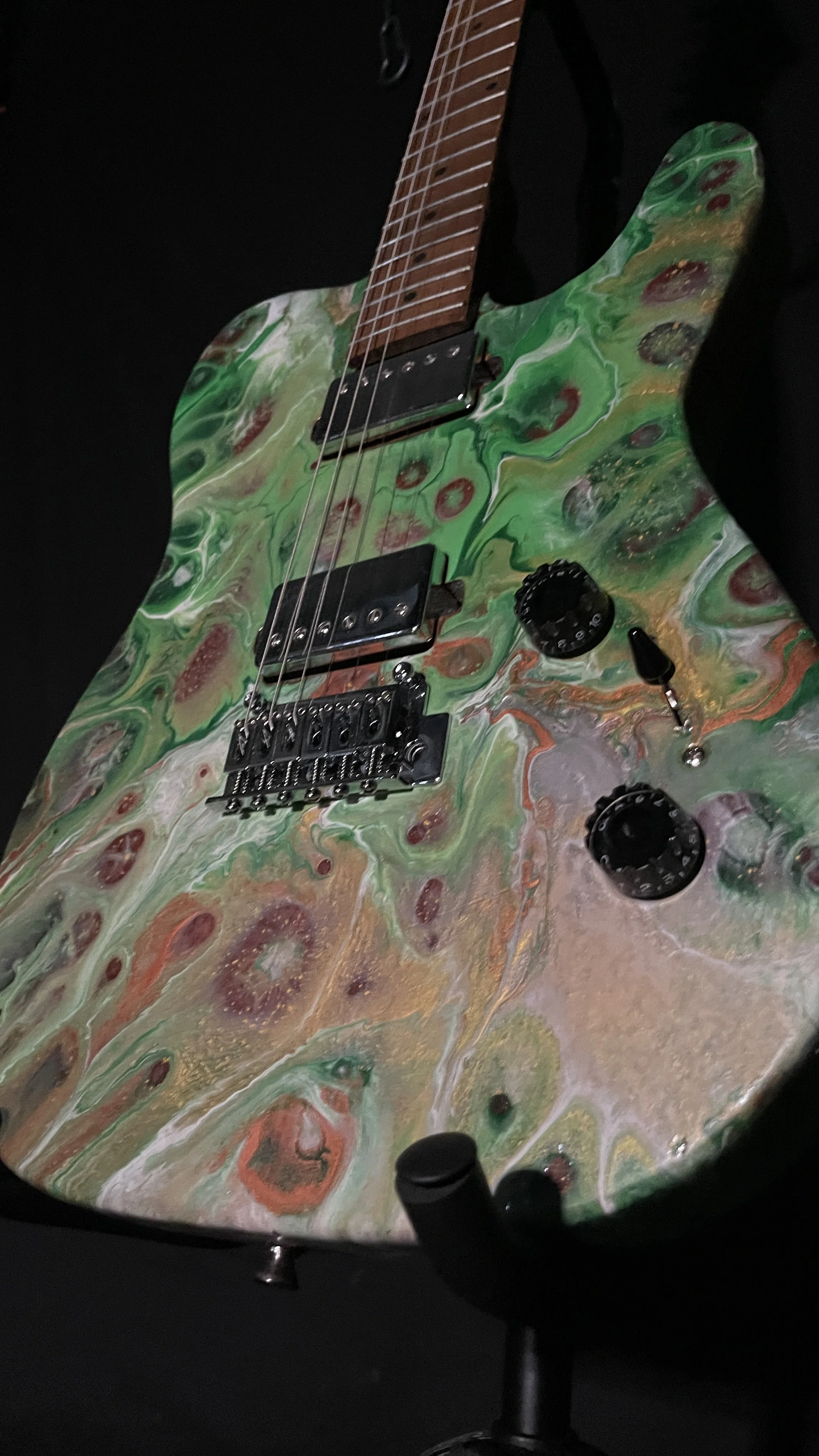 Green, white and gold acrylic poured electric guitar named Loki by Grainrot Guitars
