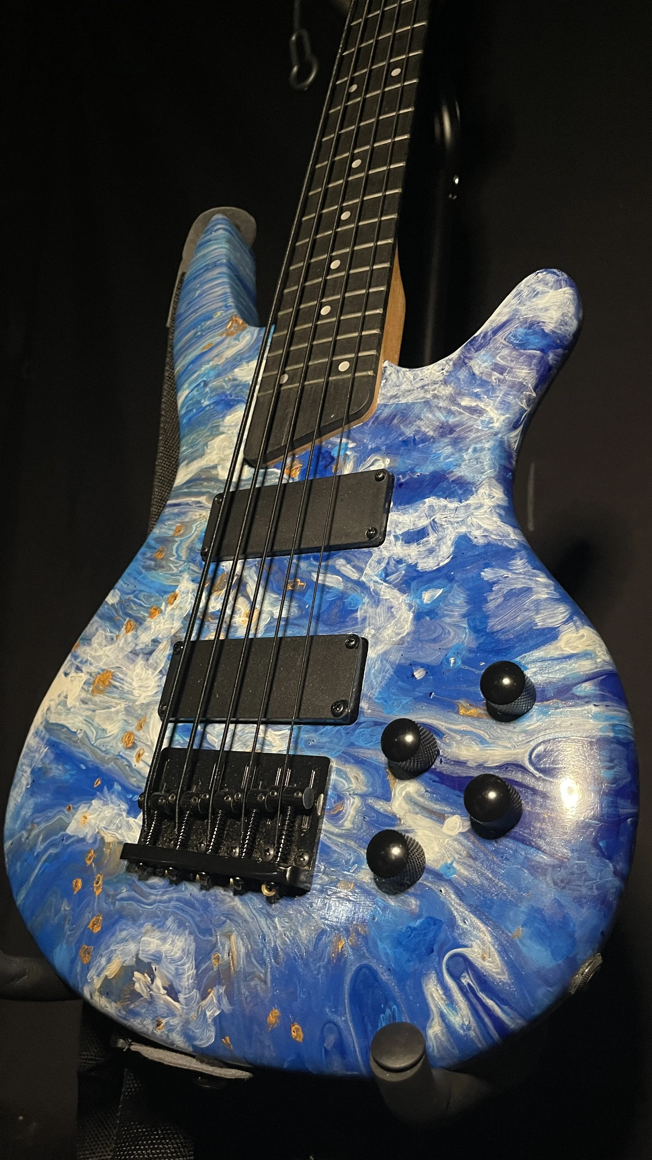 Blue, white and gold acrylic pour on a 5-string electric bass named Thalassa