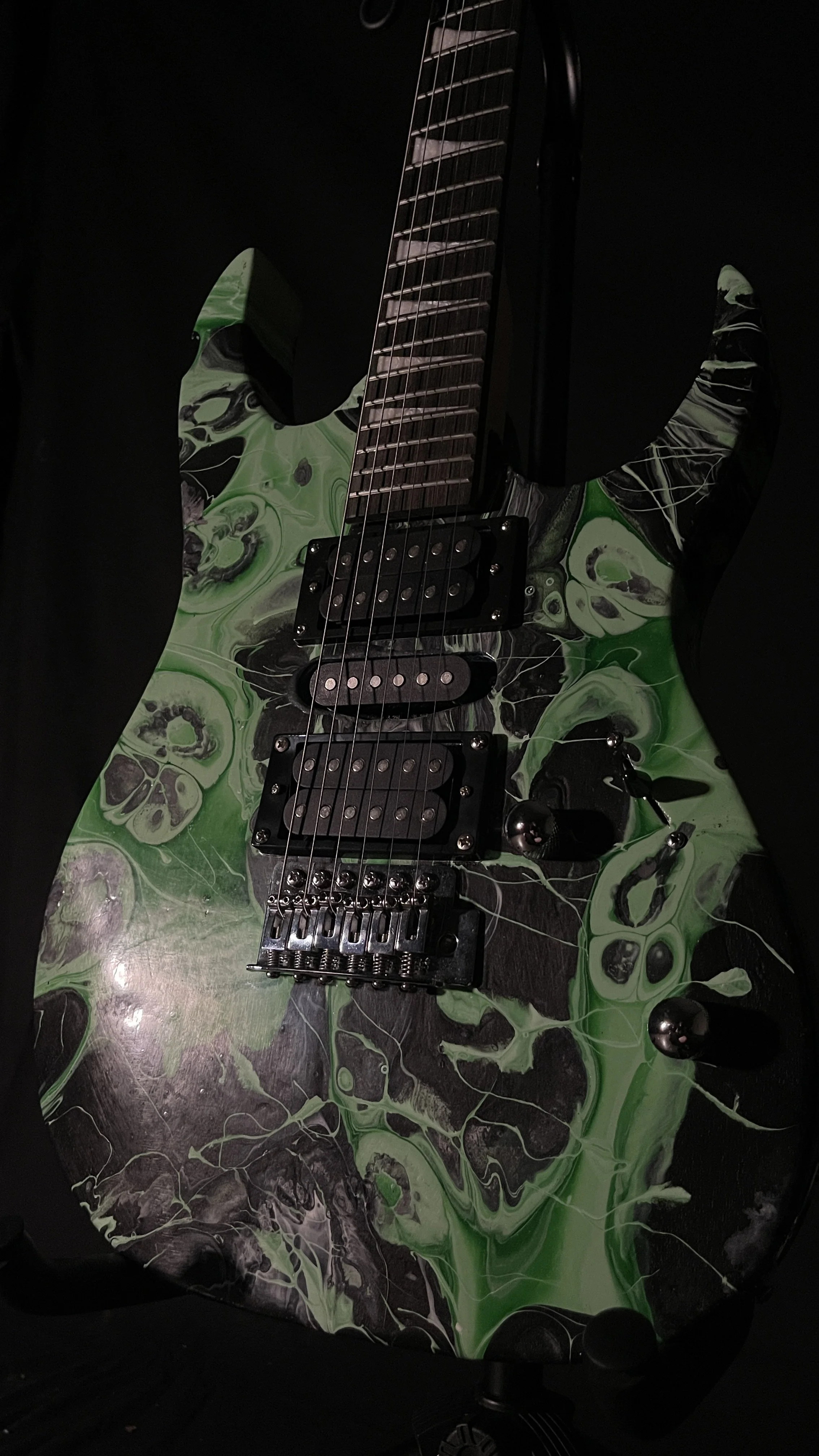 black and green acrylic poured electric guitar