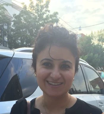 Photo of Dr. Anvari outside by a car