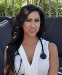 Photo of Dr. Jalota outside with a stethoscope 