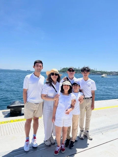 Photo of Dr. Elahi and family next to a lake
