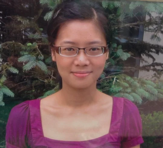 Photo of Dr. Cheung in front of a tree