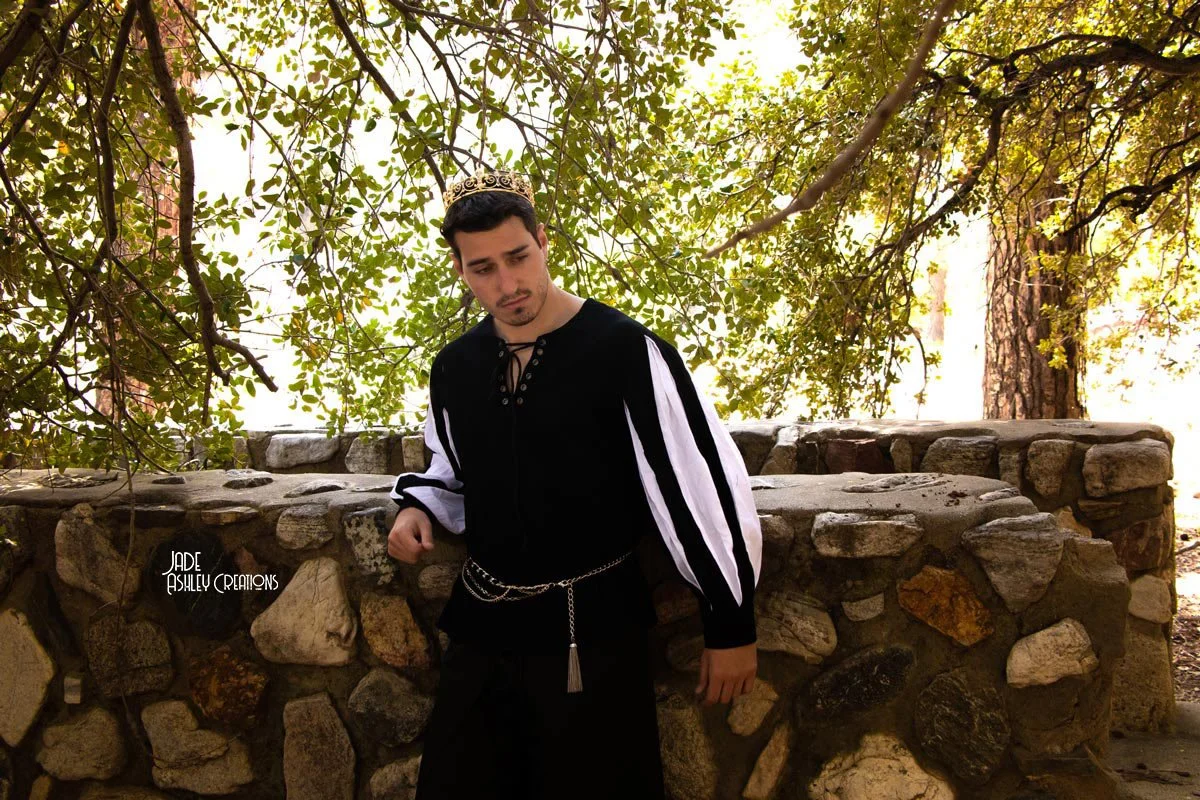 man in a costume dressed as a king with a crown