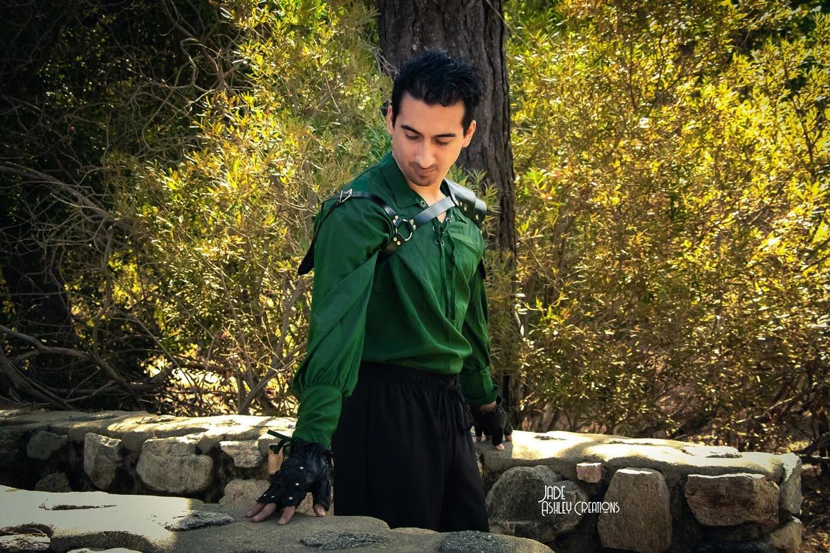 man dressed up in a folklore green outfit with gloves
