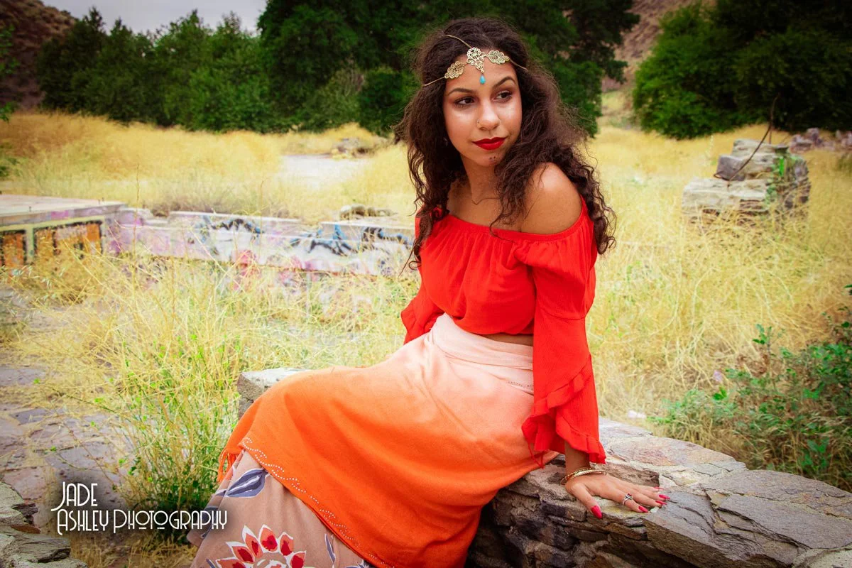 woman wearing a red and orange gypsy outfit