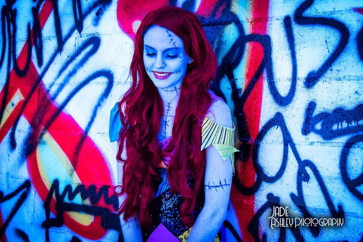 woman dressed up as sally from the night before christmas for halloween theme.