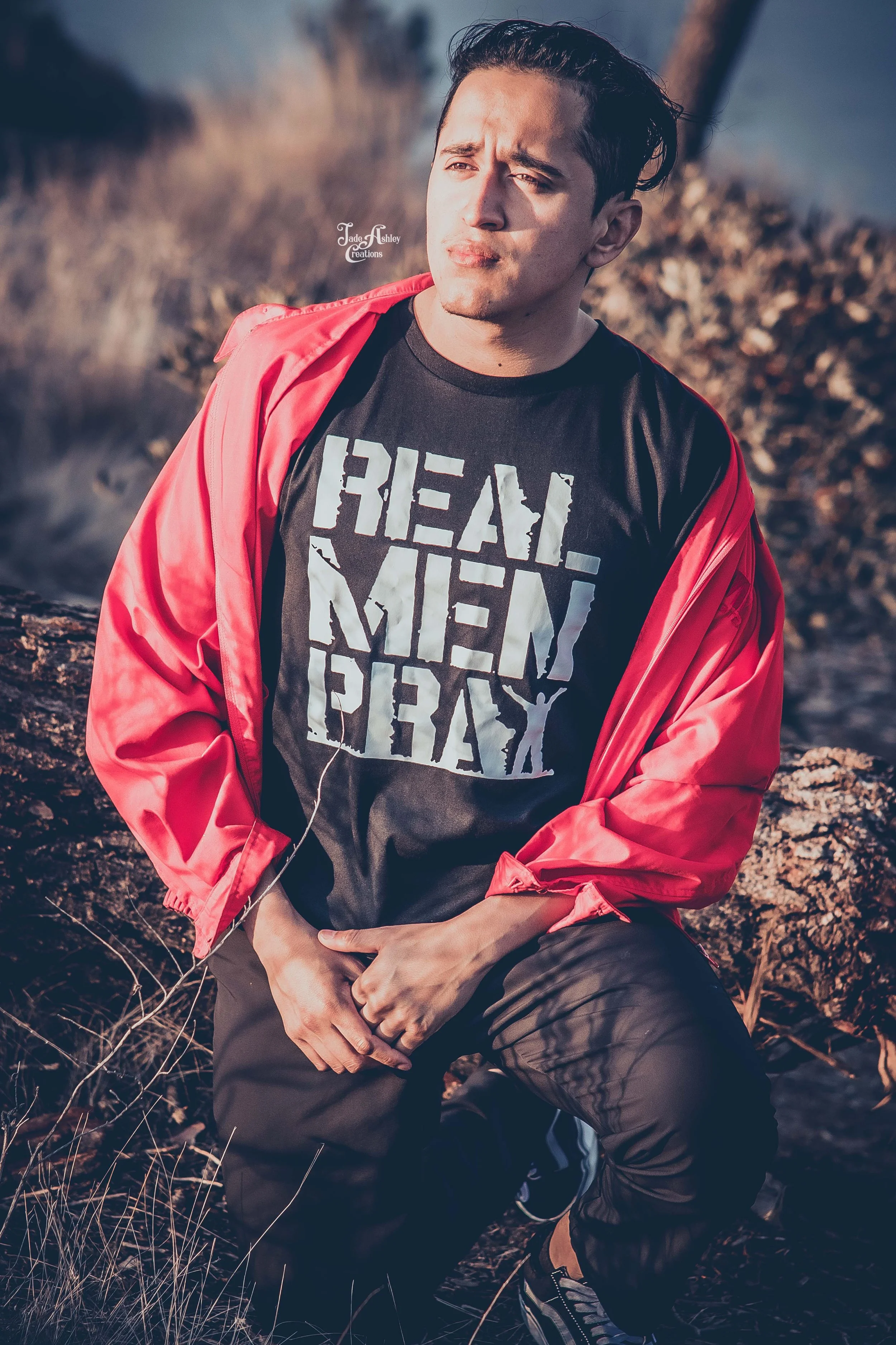 A man outdoors wearing a black t-shirt with 