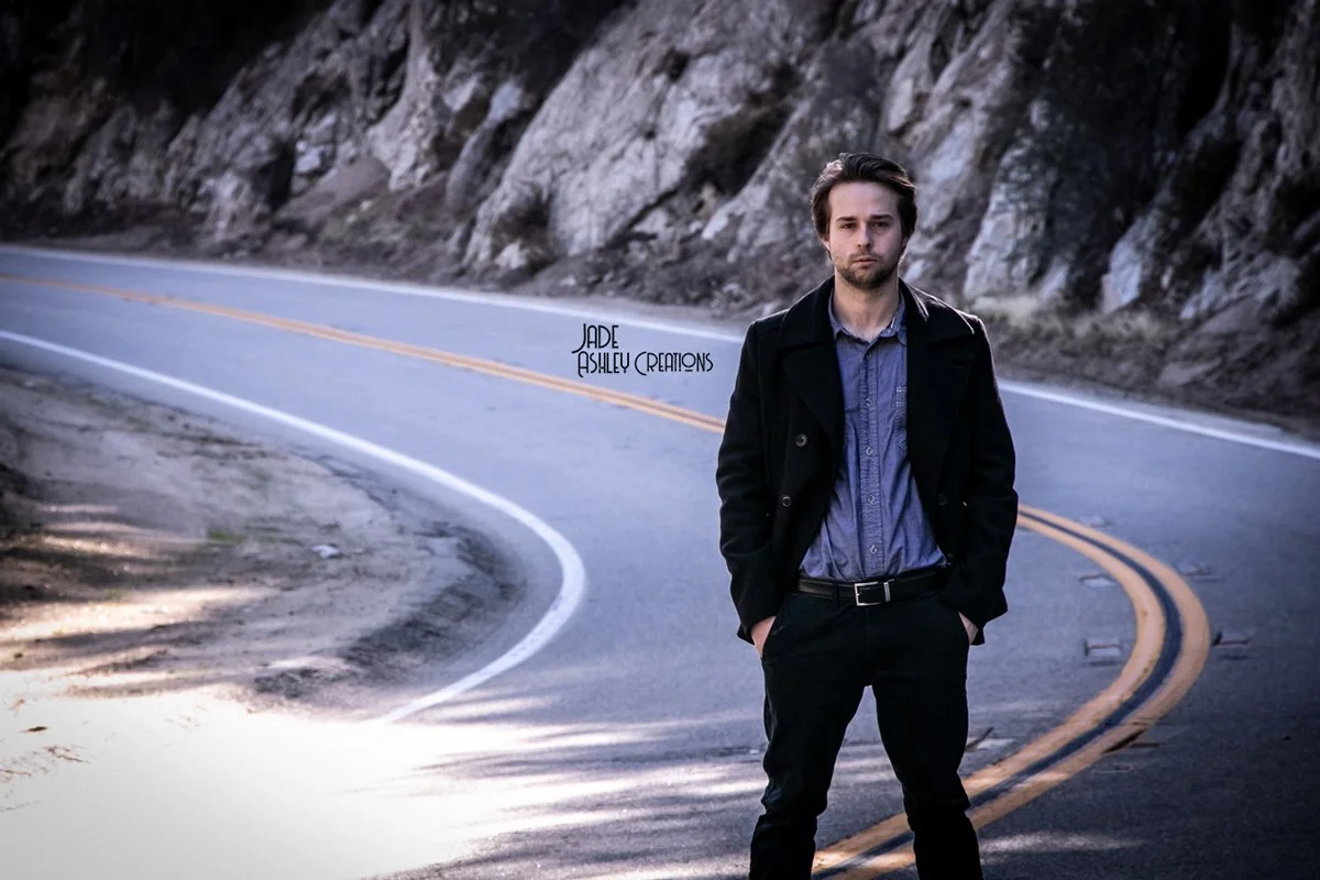 man standing in middle of road