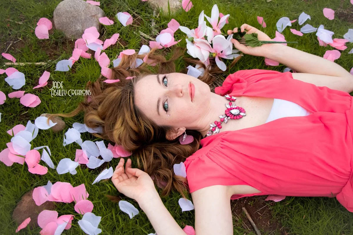 woman surrounded with rose prtrod